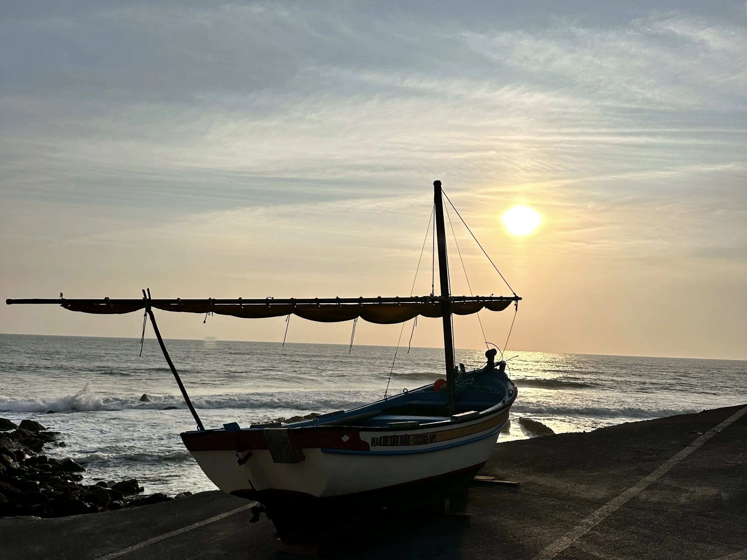 Sunset fishing boats at the Port of Assenta, Portugal