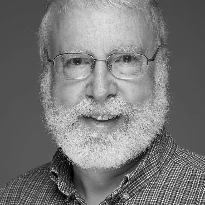 Dr. NEIL F. COMINS