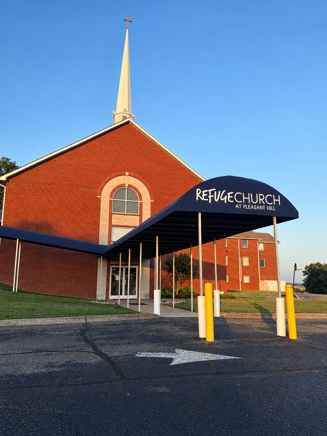 Red-Brick Church with Navy Entrance Canopy.png