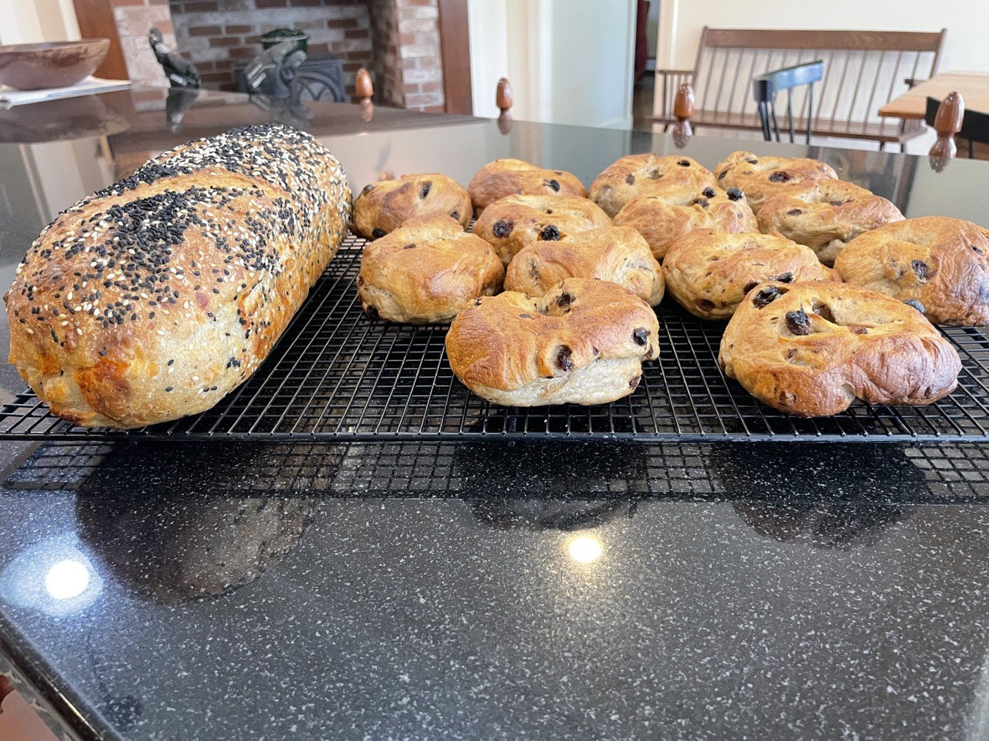 Fresh from the oven! 🥯🍞 Our board member Debbie has been busy creating these beautiful cinnamon raisin bagels and Parmesan Black Pepper Sourdough bread. #MaineGrainAlliance
