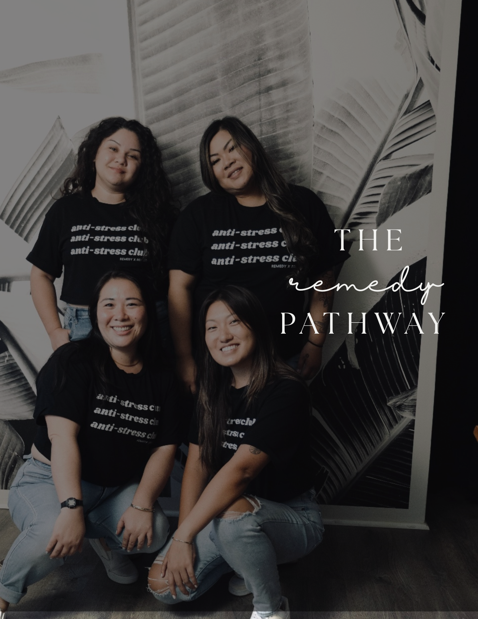 Group of four women posing in front of a black and white wall art with text overlay 'The Remedy Pathway.' All are wearing black T-shirts with white text.