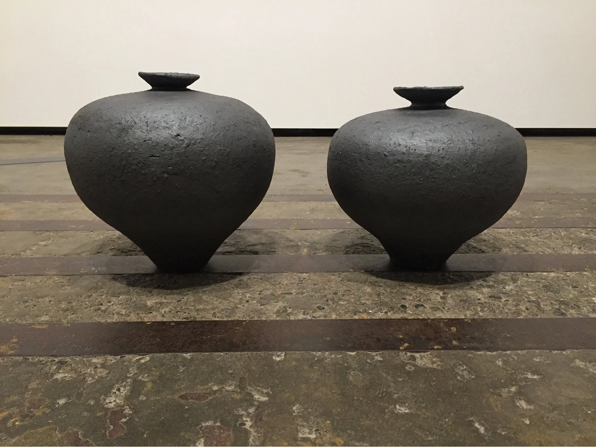 Michael Edward Miller Fracture , 2016, hand-coiled reduction fired storage jars, granite feldspar, black smokey quartz crystal