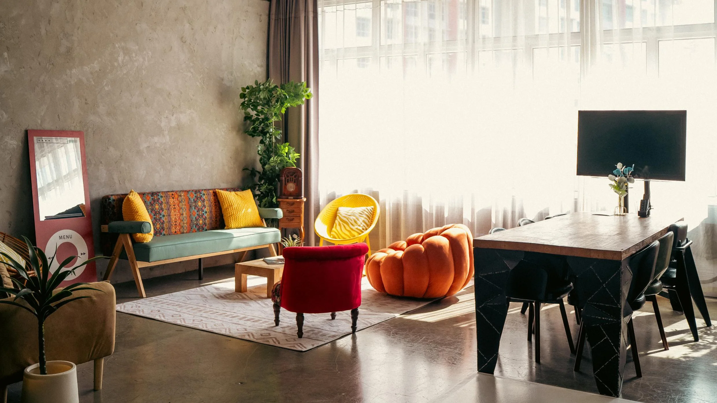 The space includes a 2.4m long dining table and TV monitor to hook up your work