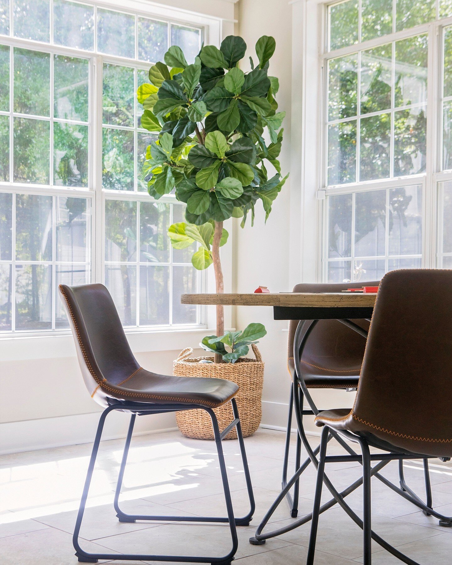 We're obsessed with how light and bright this sunroom is! This was an area that was extra space and we could imagine some home buyers would have trouble envisioning what to do with this space, so we turned it into a comfortable, inviting game room. W