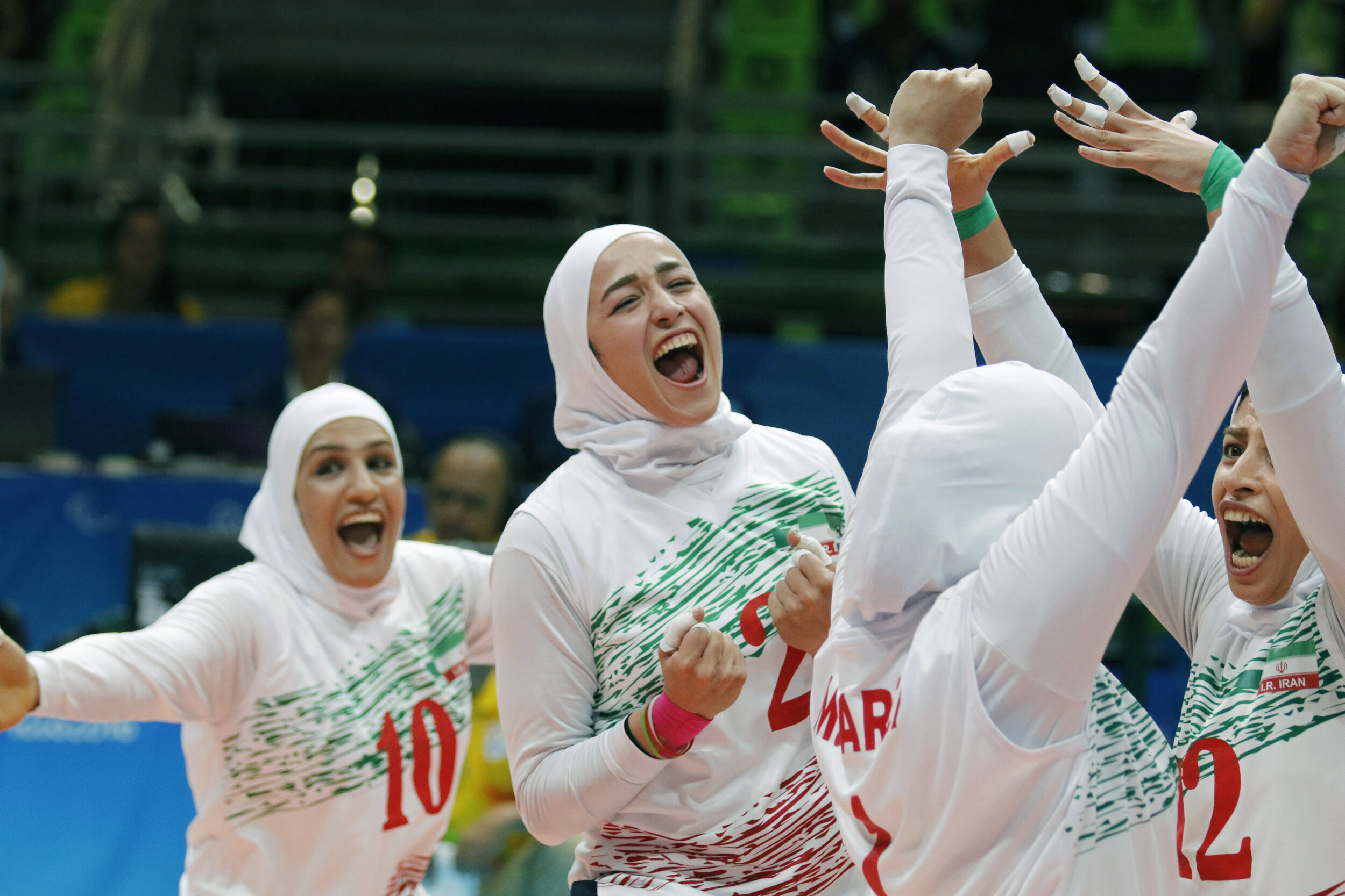 Iran’s Zeinab Maleki Dizicheh (2), Tayebeh Jafarivarda (10) and team celebrate after scoring a point during the women's sitting volleyball preliminary games at the 2016 Paralympic Games in Rio de Janeiro, Brazil, on Saturday, Sept. 10, 2016. Iran to