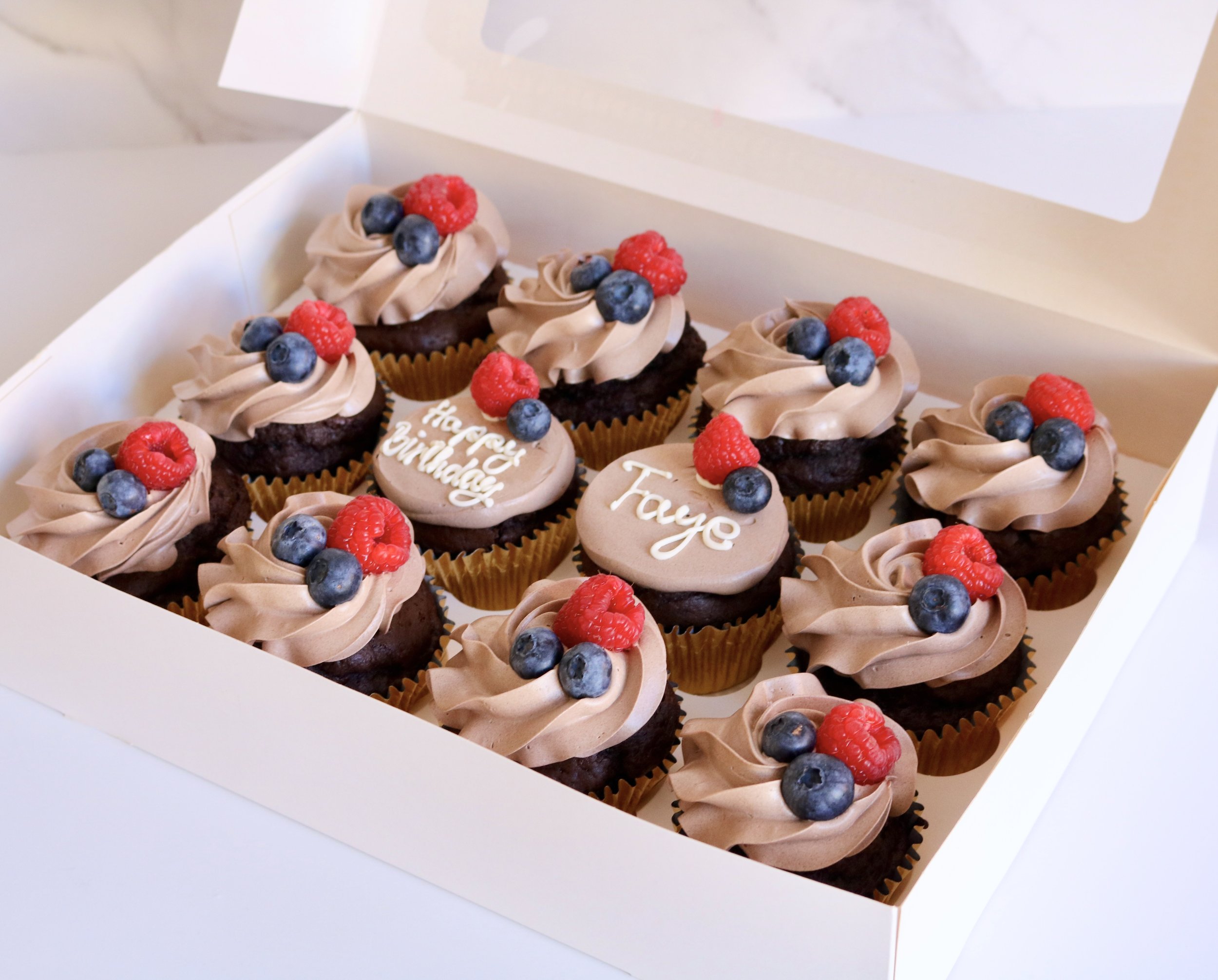 vanilla and chocolate cupcakes box with happy birthday message