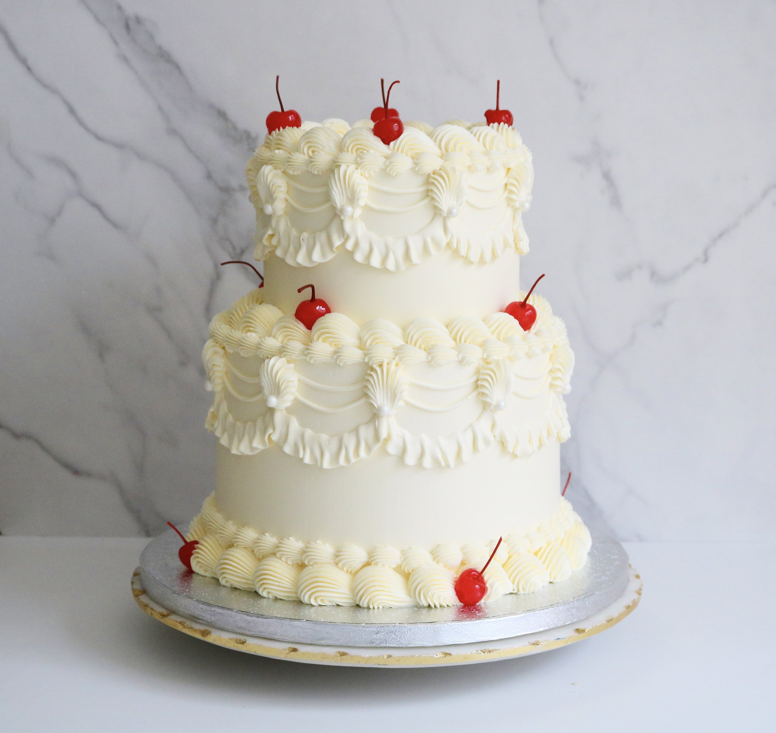 vintage wedding cake in London in ivory and neutral tones