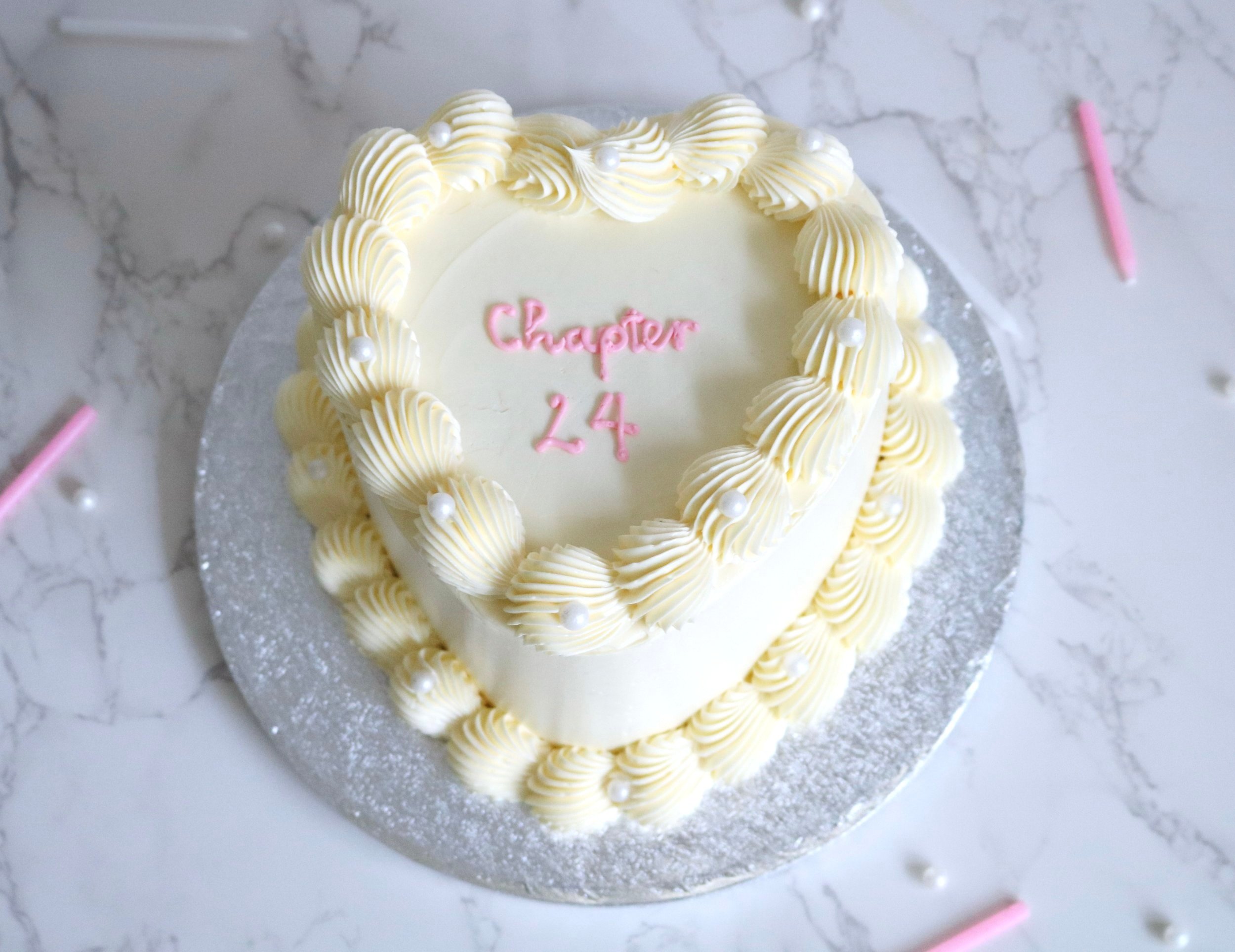 adorable vintage heart cake with edible peals and cherries decorations with a custom cake message on top