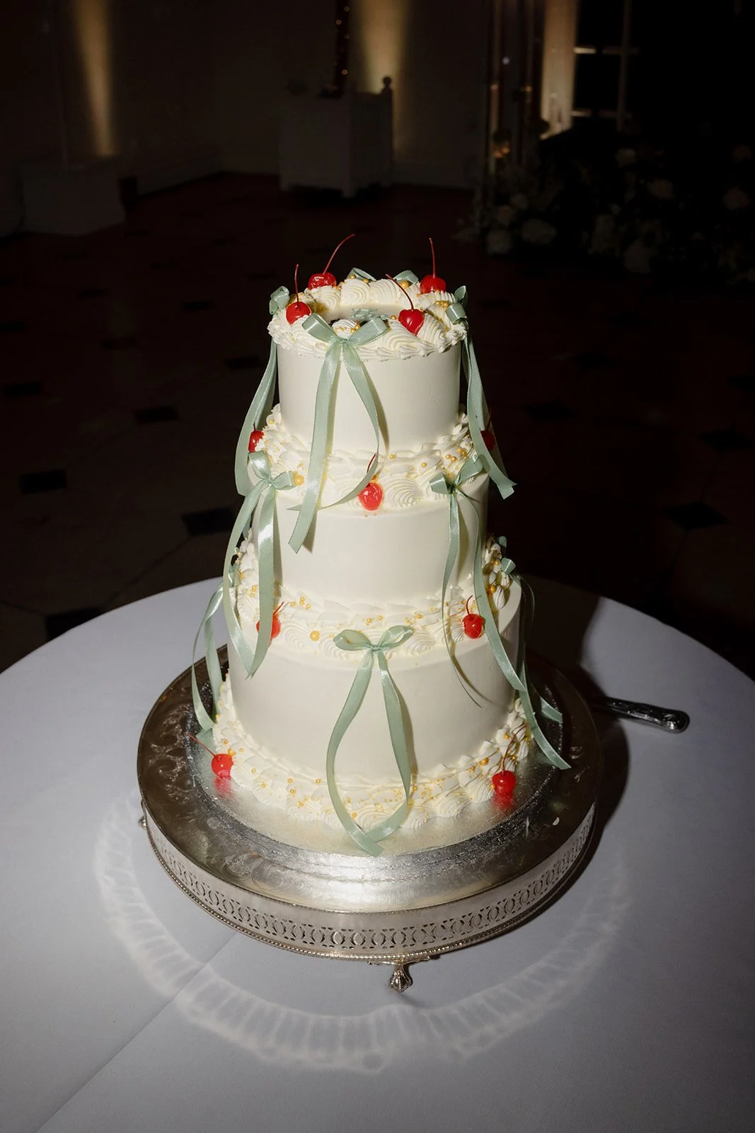 Vintage ribbon wedding cake with hand-piped buttercream borders and pearl details