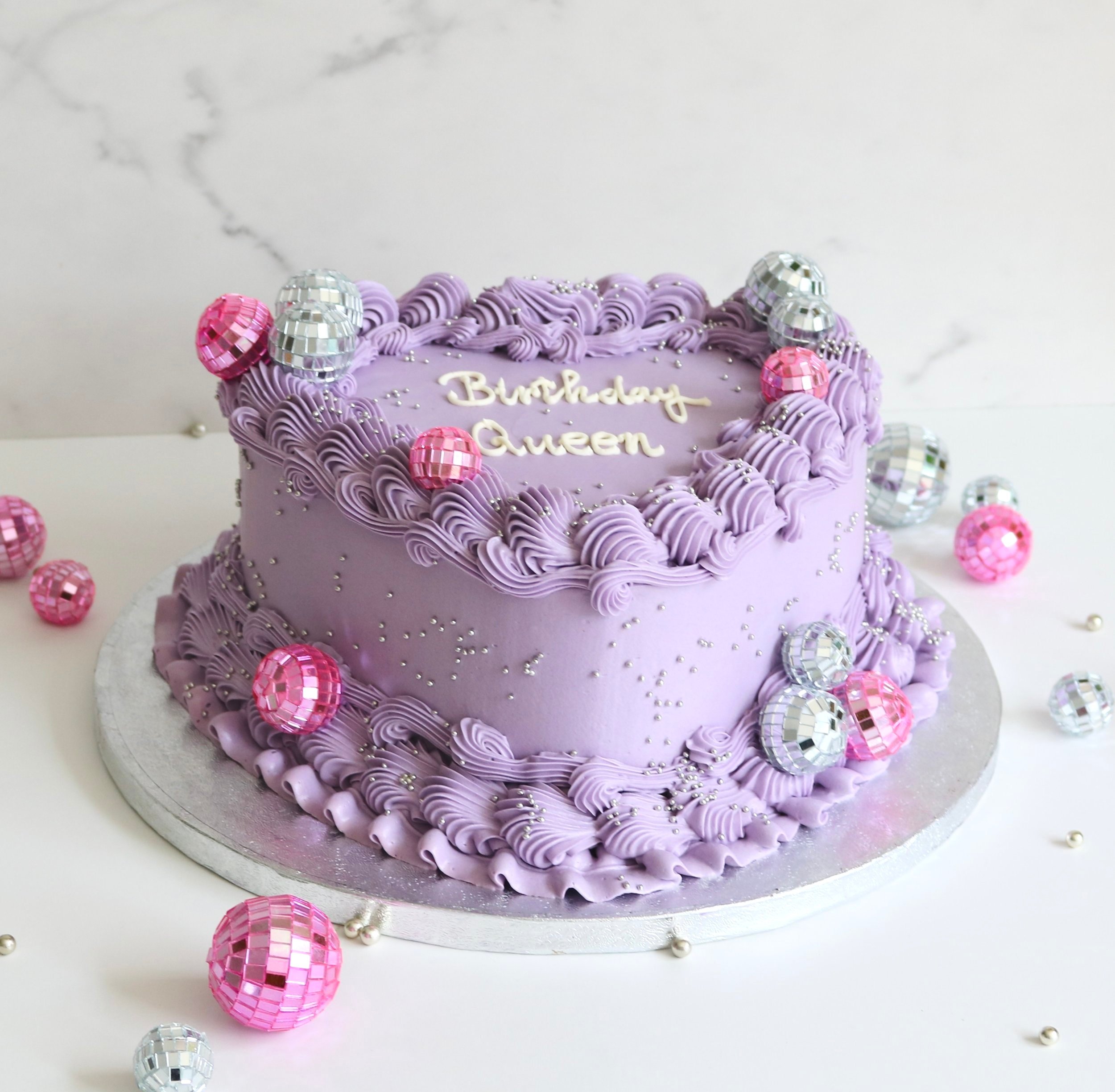 vintage cake with disco balls decorations in London