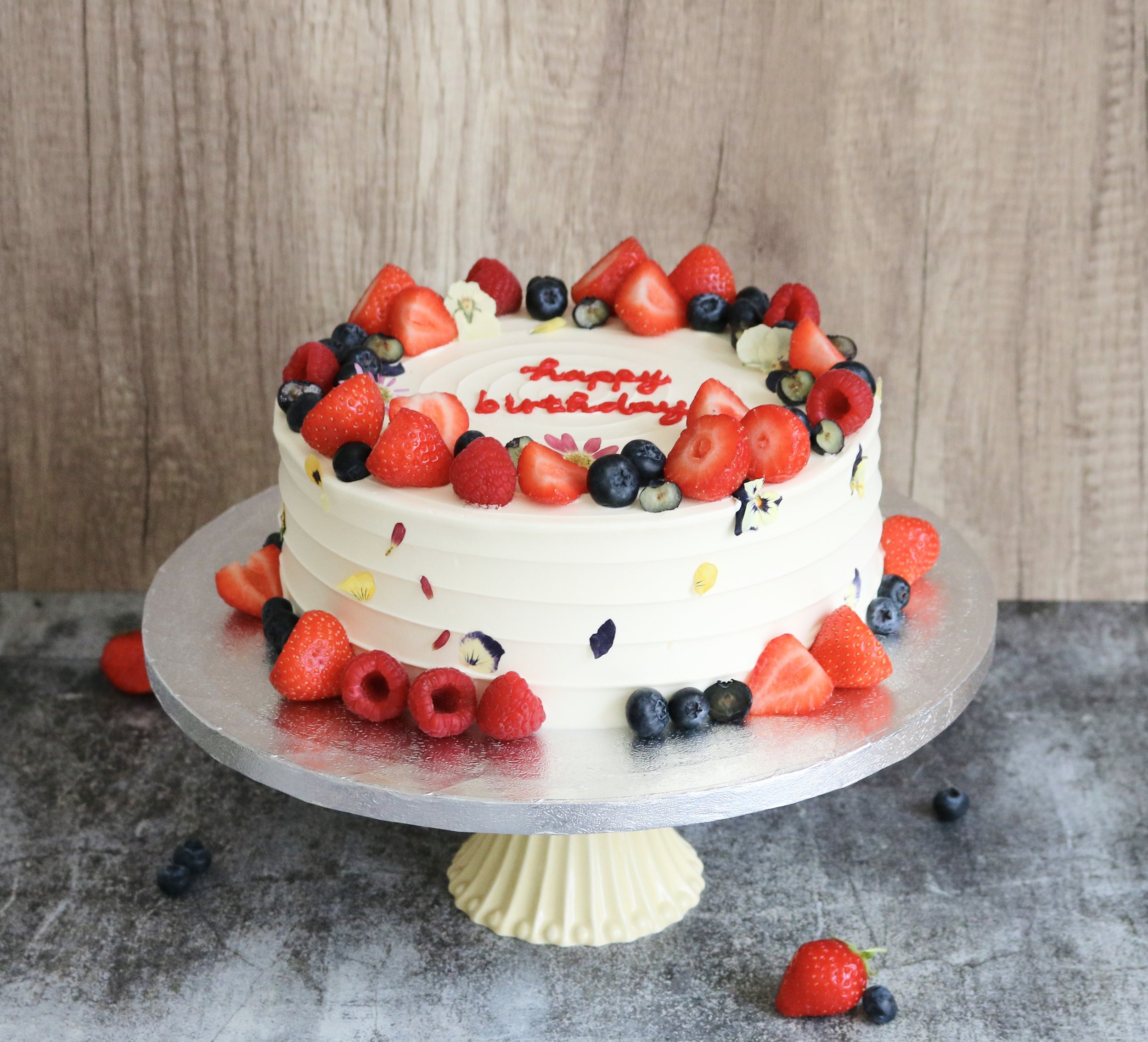 rustic cake with fresh fruits and edible flowers for all occasions