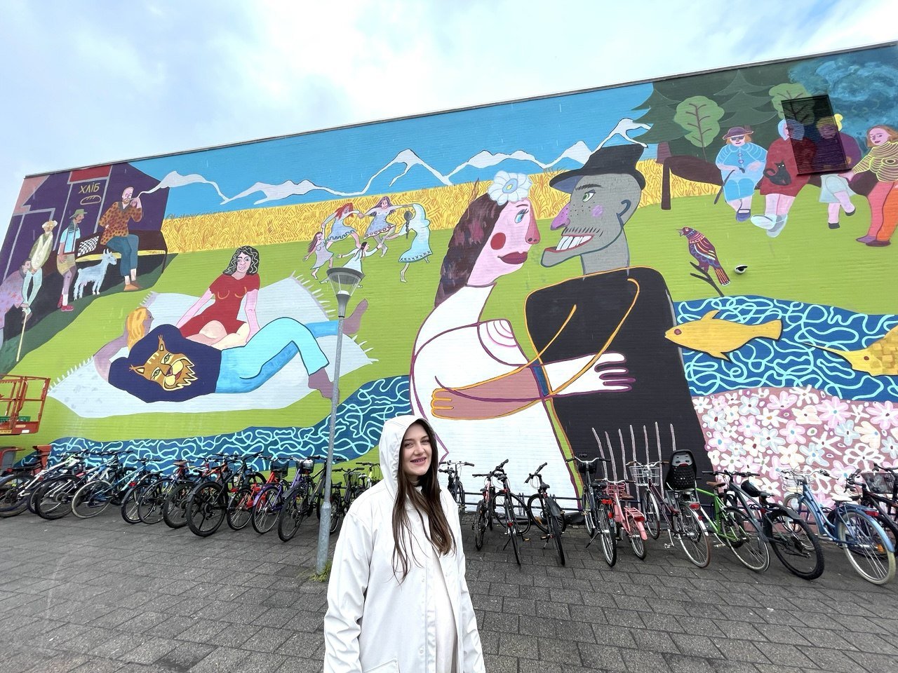 Artist next to mural 2