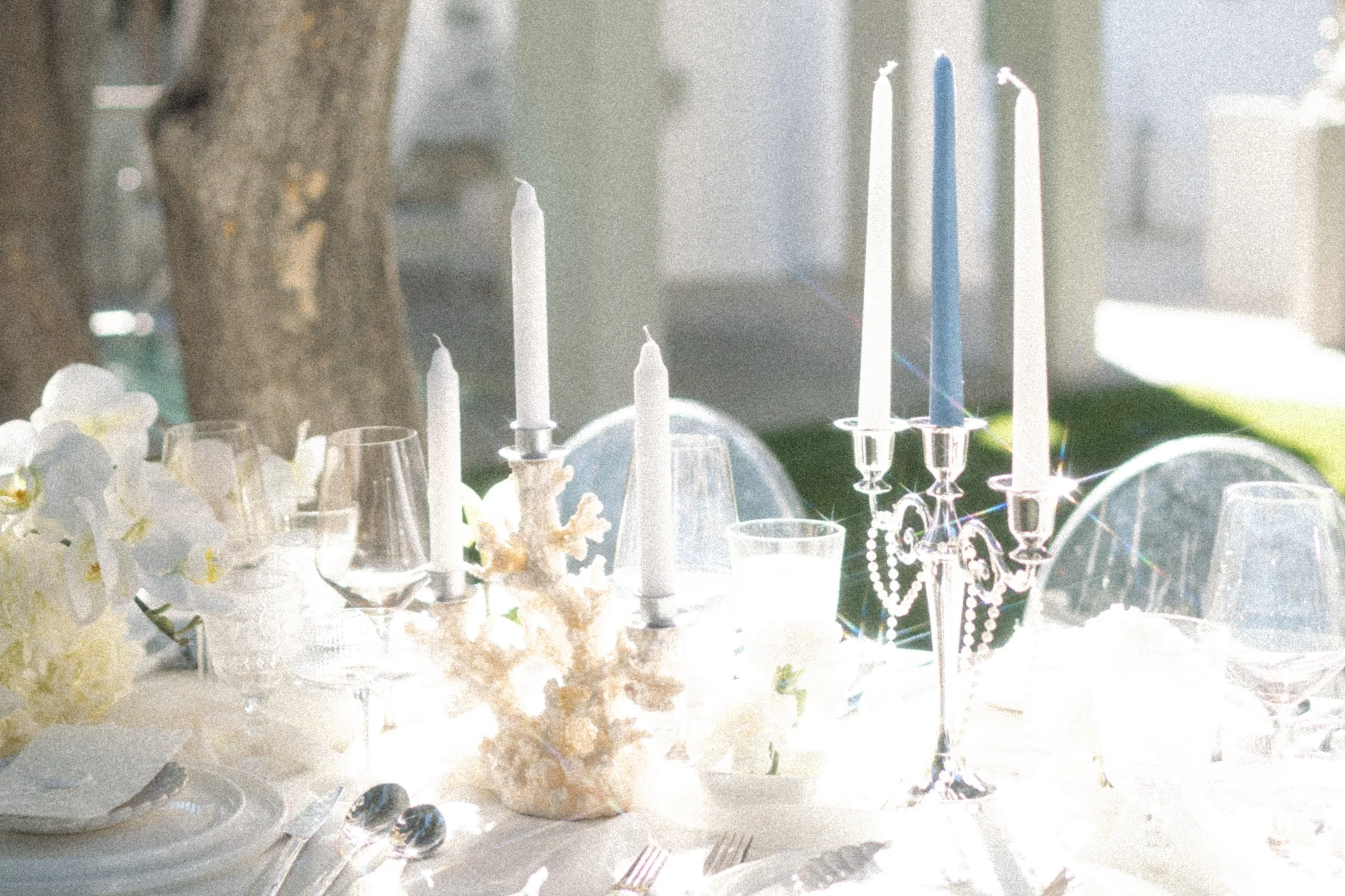 Mediterranean-inspired wedding tablescape with natural textures and neutral tones.