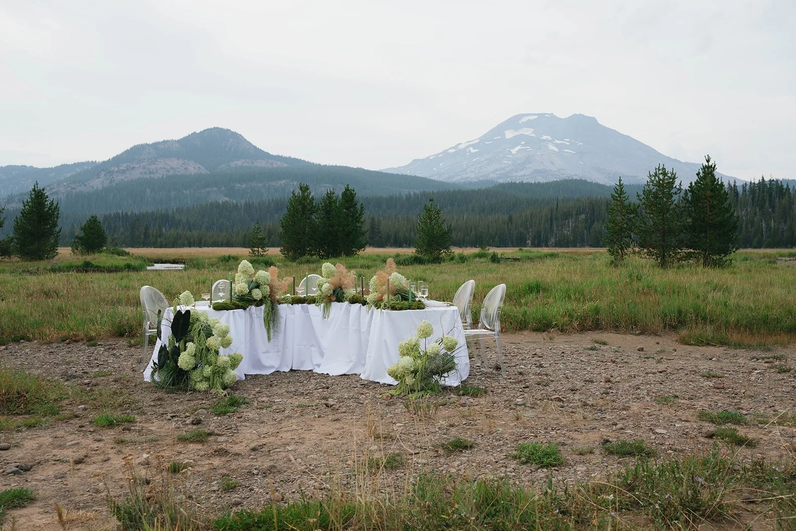 Elopement table in a grass field at Sparks Lake
