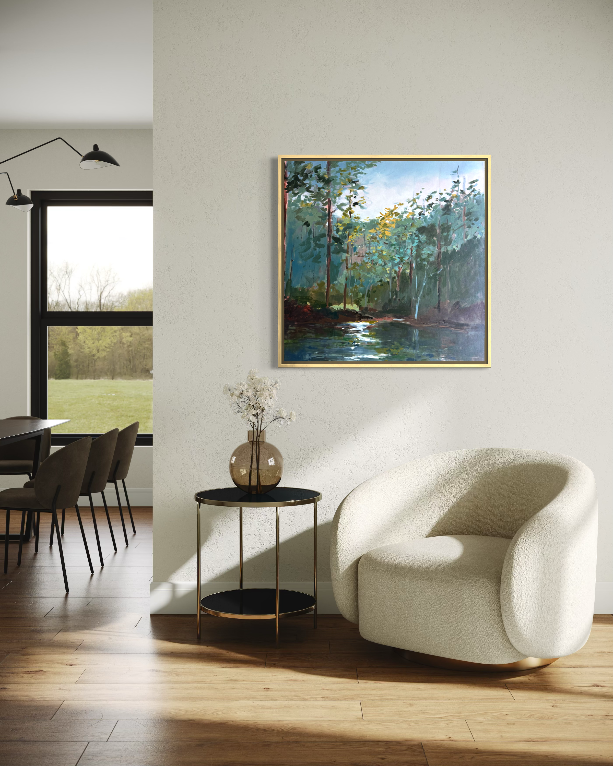 At the Edge of Stillness, an original landscape painting by Cheyenne Trunnell, displayed in a light-filled modern interior above a cream boucle chair.