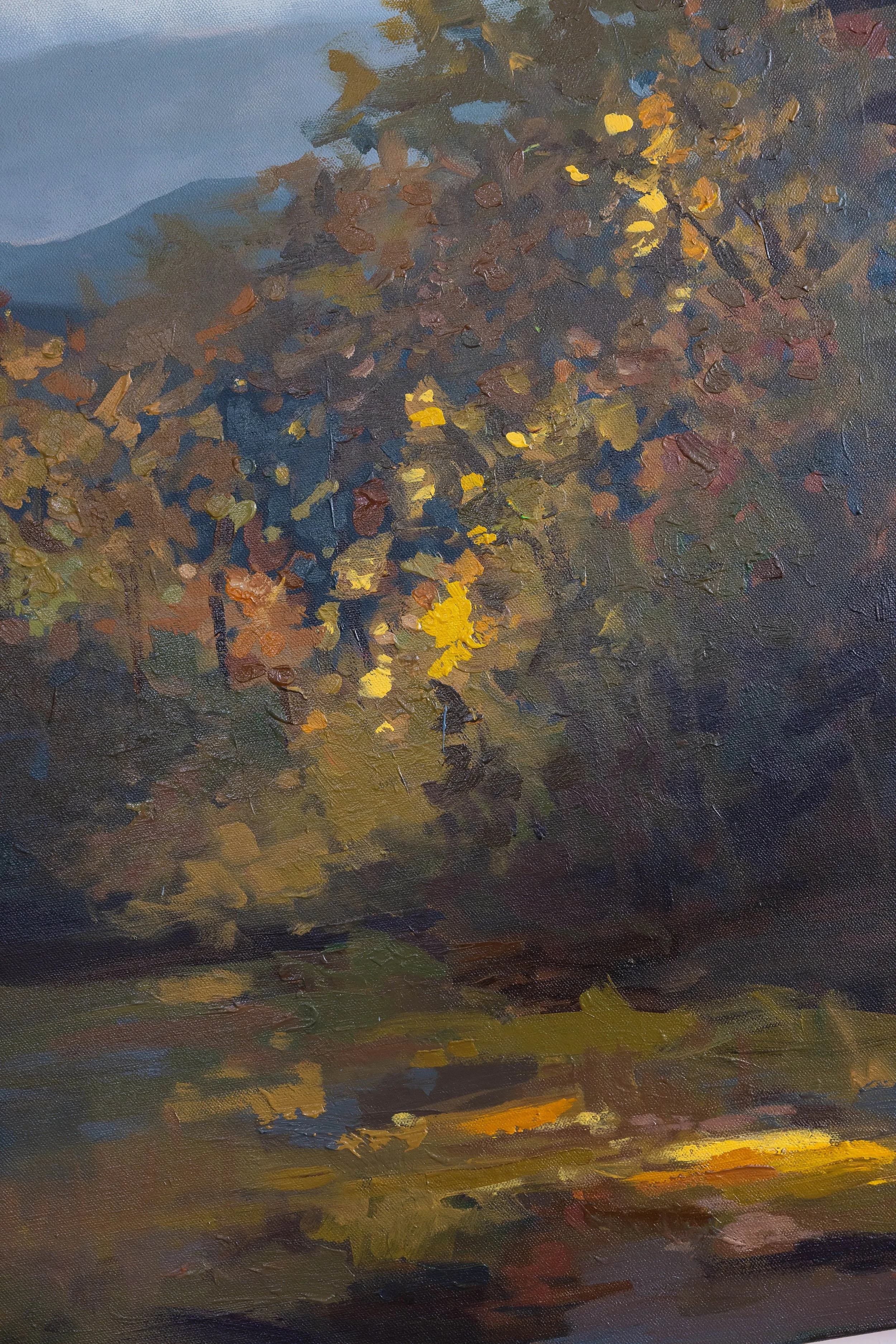 Detail of an original acrylic landscape painting showing warm golden autumn foliage against deep blue and green mountain tones.