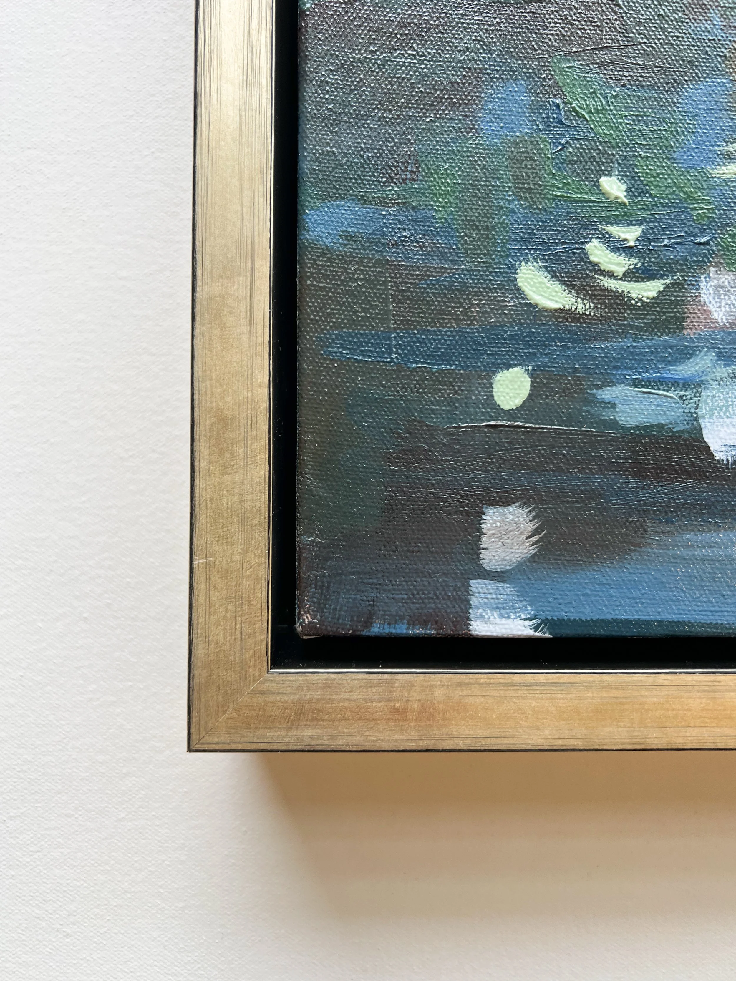 Original oil landscape painting by Asheville artist Cheyenne Trunnell depicting the corner of the champagne frame of the painting.