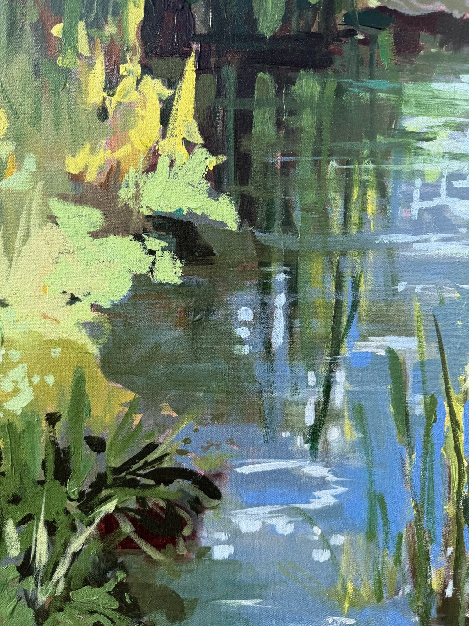 Close-up of Beside the Still & Quiet Water showing blue reflections on a peaceful stream, surrounded by fresh green foliage and soft yellow highlights.