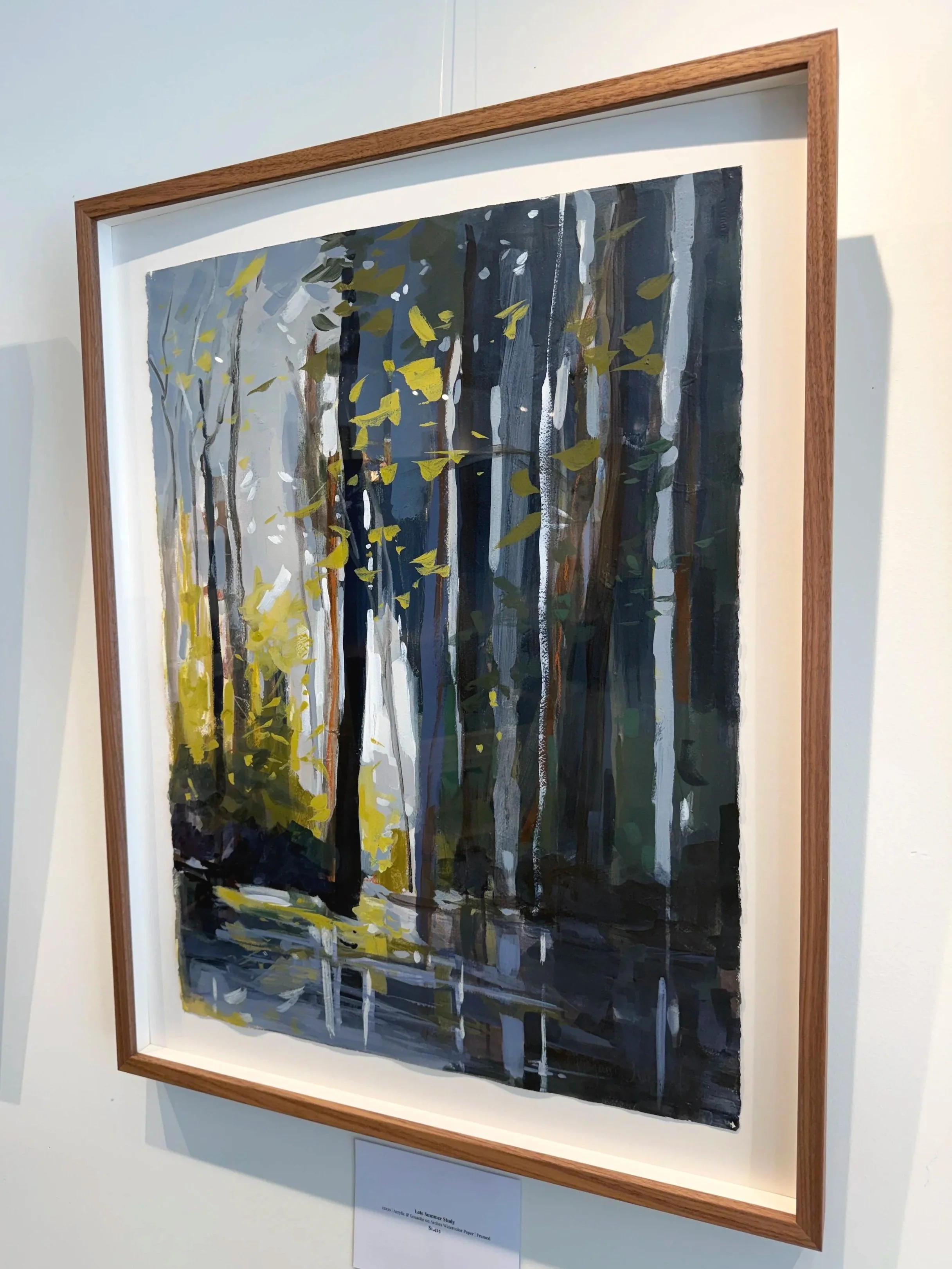 Acrylic woodland painting by Asheville artist Cheyenne Trunnell framed in walnut and displayed on a gallery wall, 22×30 inches.
