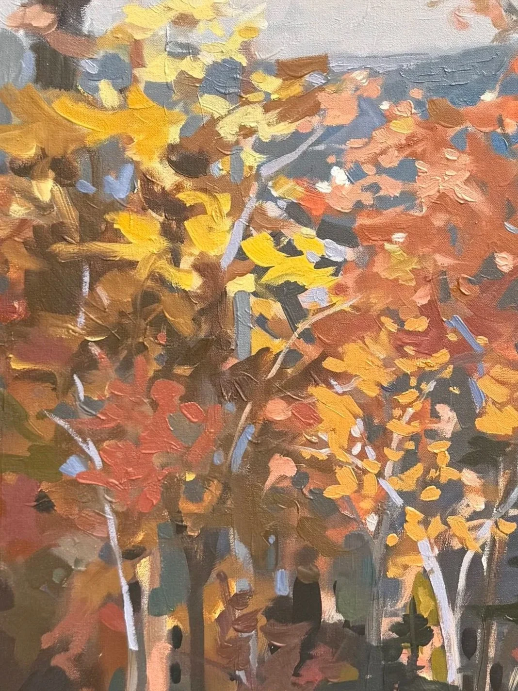 Detail of All of the Trees of the Forest Will Sing for Joy by Cheyenne Trunnell, featuring brilliant golden and orange leaves against soft blue-gray mountain ridges.
