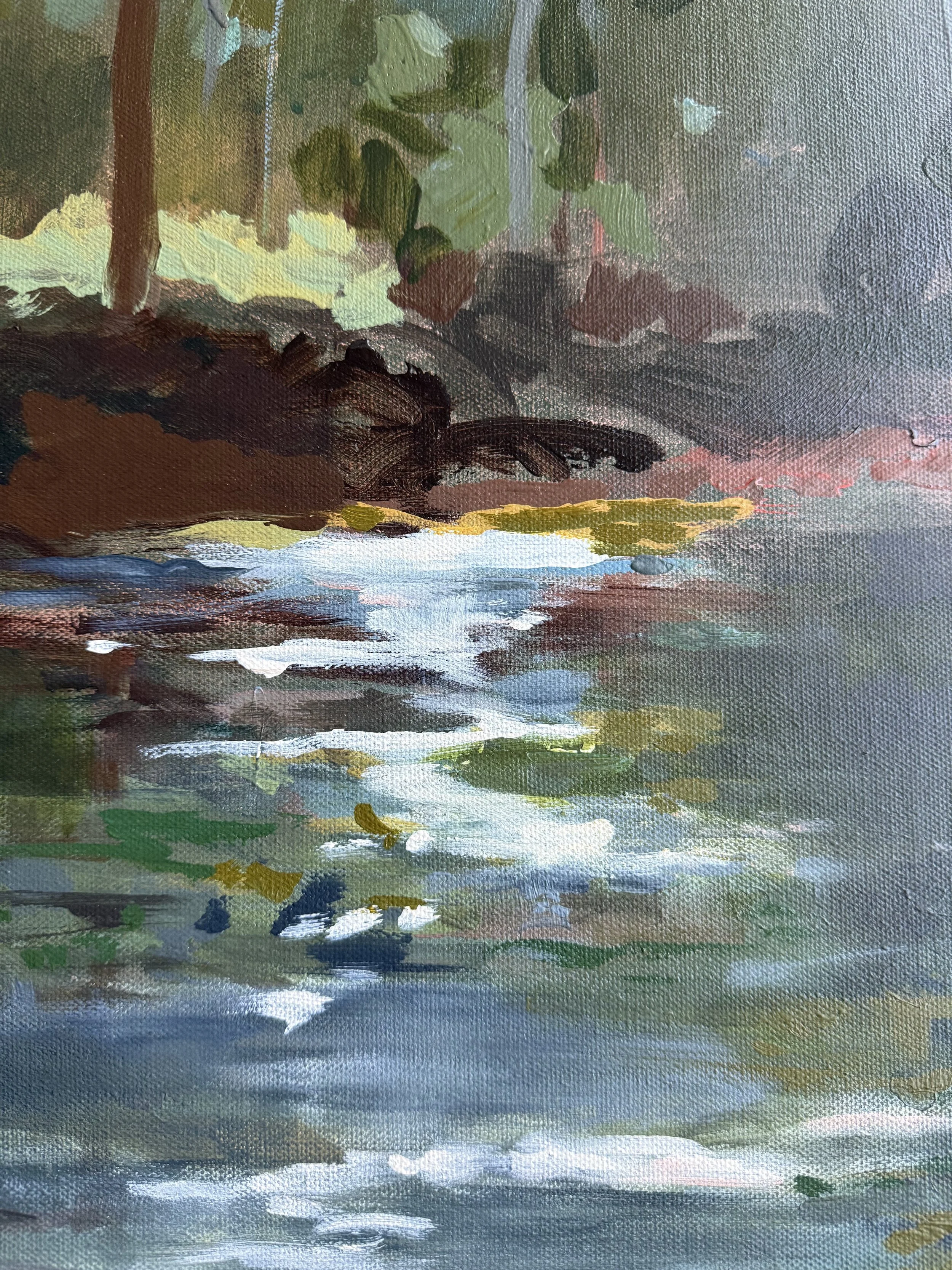 Close detail of reflective water, luminous white brushstrokes, and the dark wooded bank in At the Edge of Stillness.