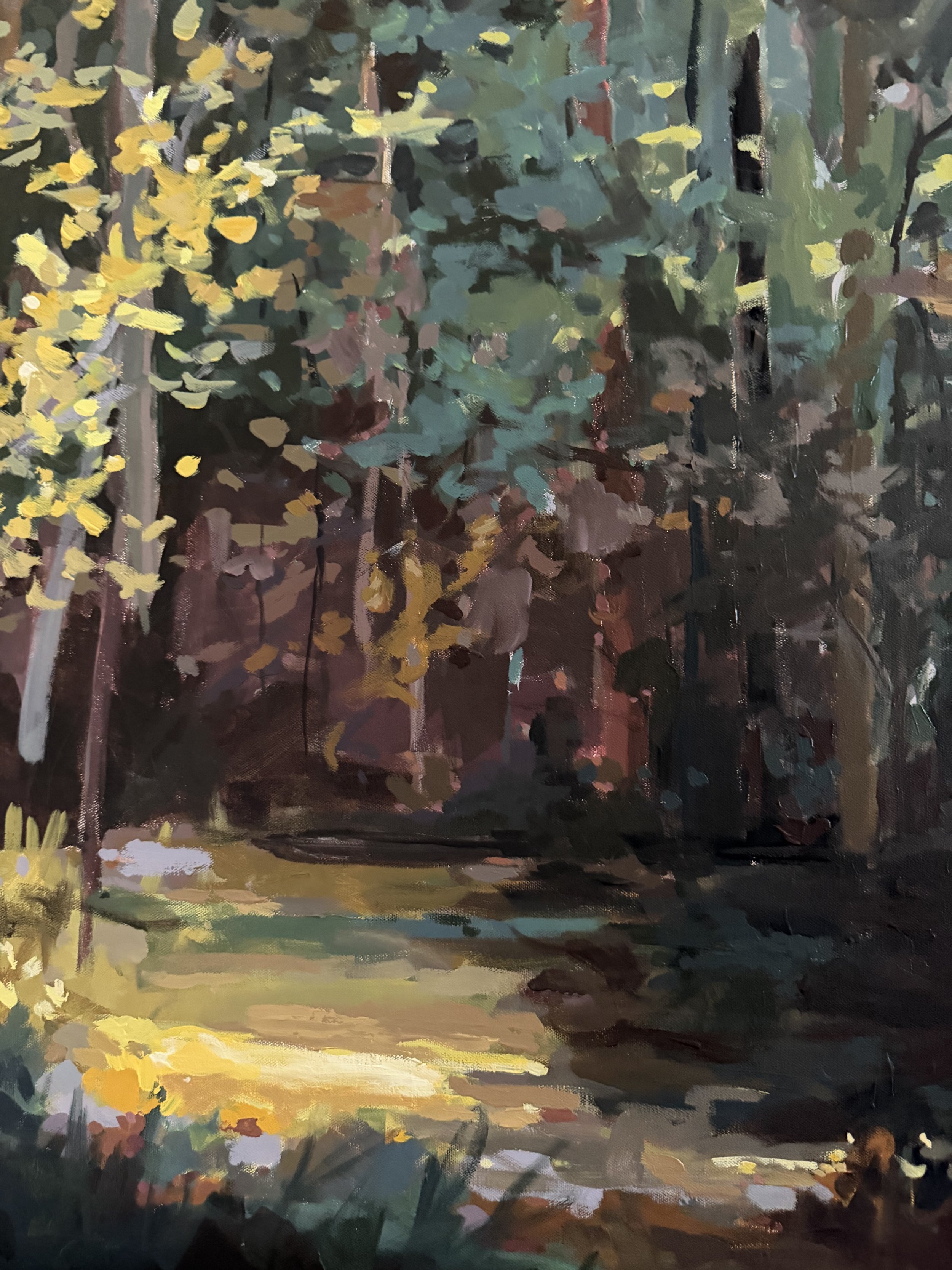 Detail of mixed media landscape painting showing forest floor, golden light, and soft brushstrokes capturing movement and depth in the woodland.
