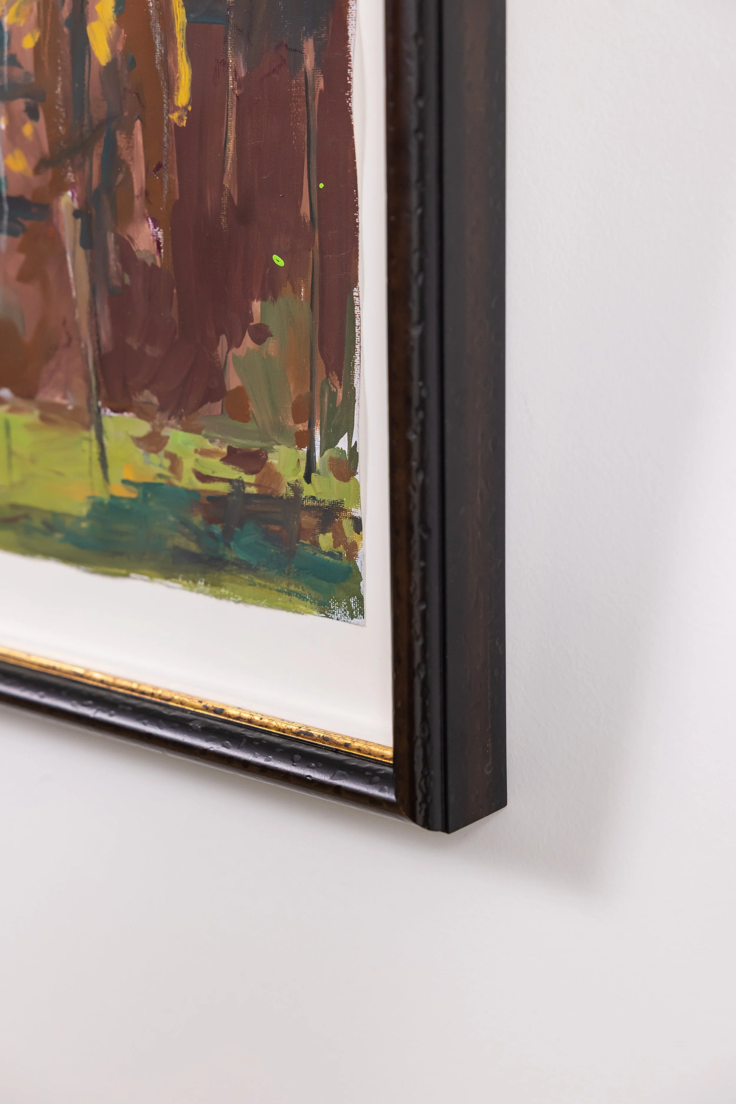 Detail of framed landscape painting by Asheville artist Cheyenne Trunnell showing brushwork and dark wood frame.