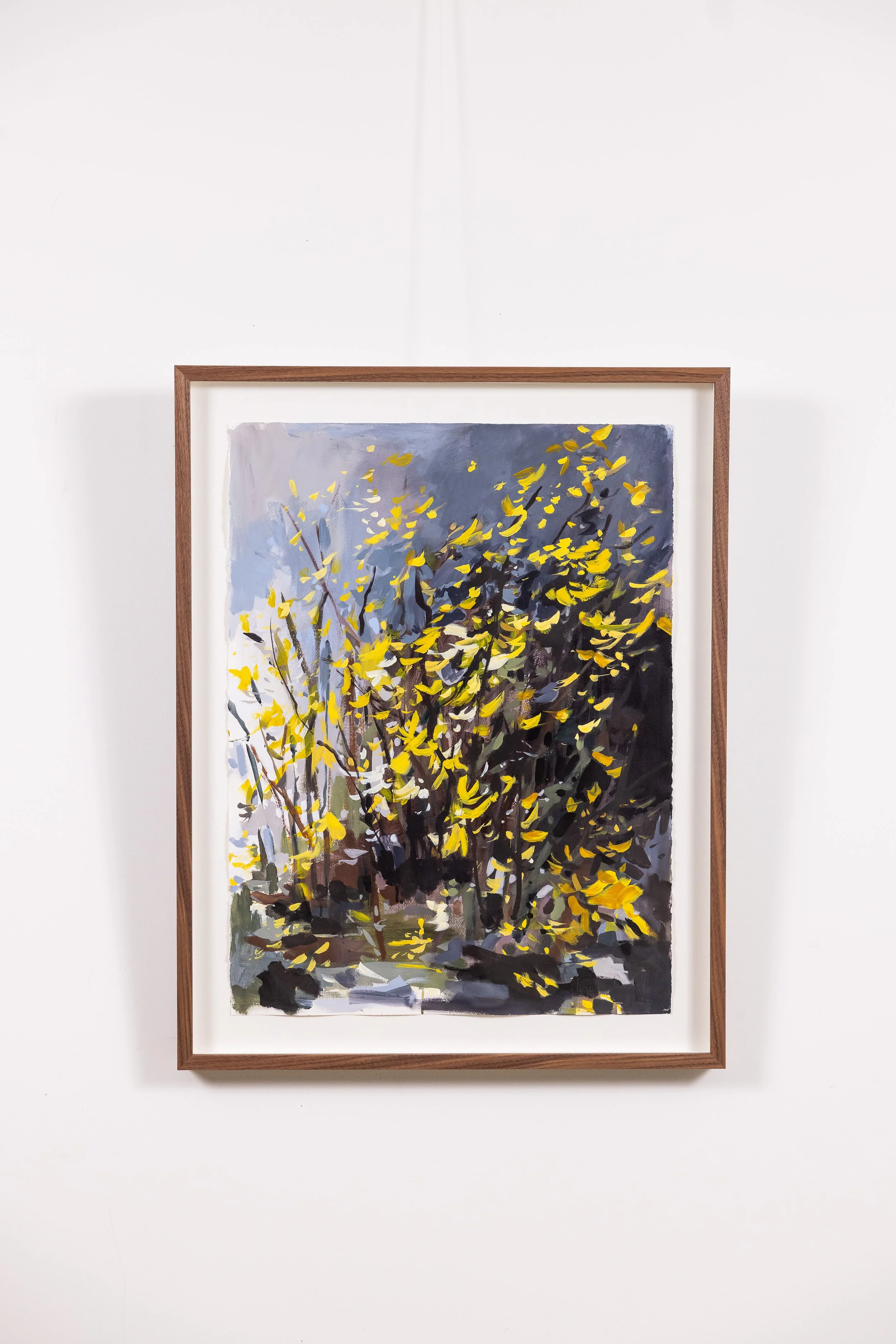 Framed landscape painting by Asheville artist Cheyenne Trunnell featuring yellow foliage and forest light.