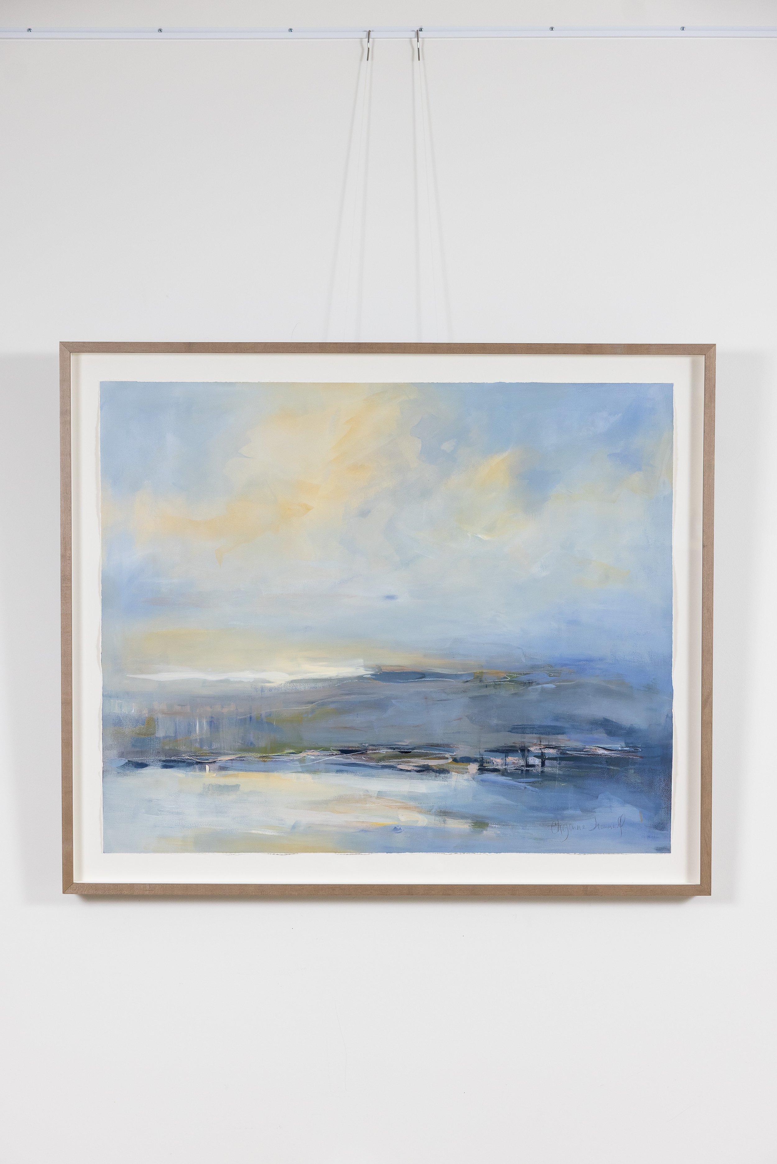 Framed abstract landscape painting by Asheville artist Cheyenne Trunnell in soft blue and neutral tones.
