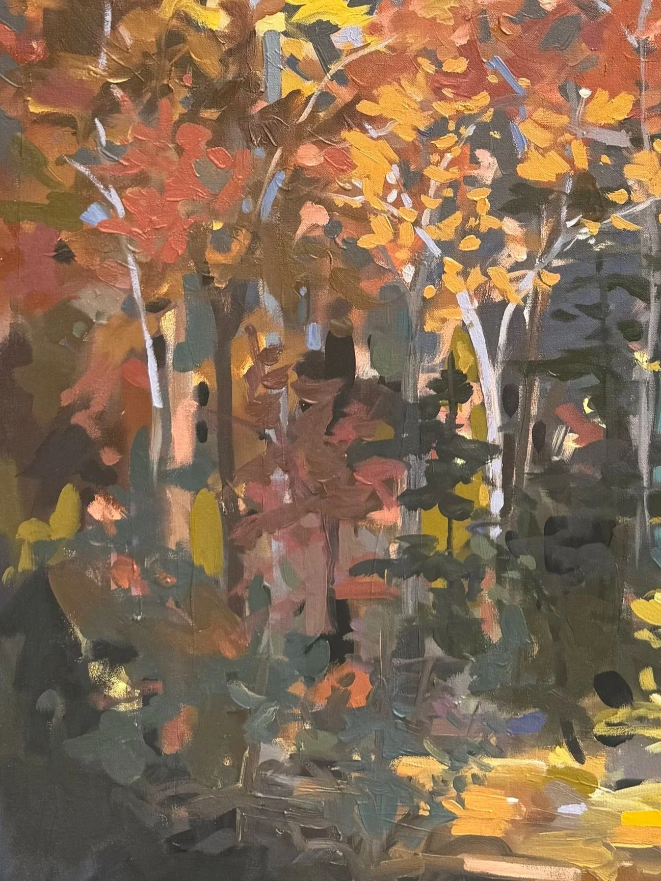 Close-up of All of the Trees of the Forest Will Sing for Joy highlighting rich autumn colors, dark woodland shadows, and touches of sunlight along the forest floor.