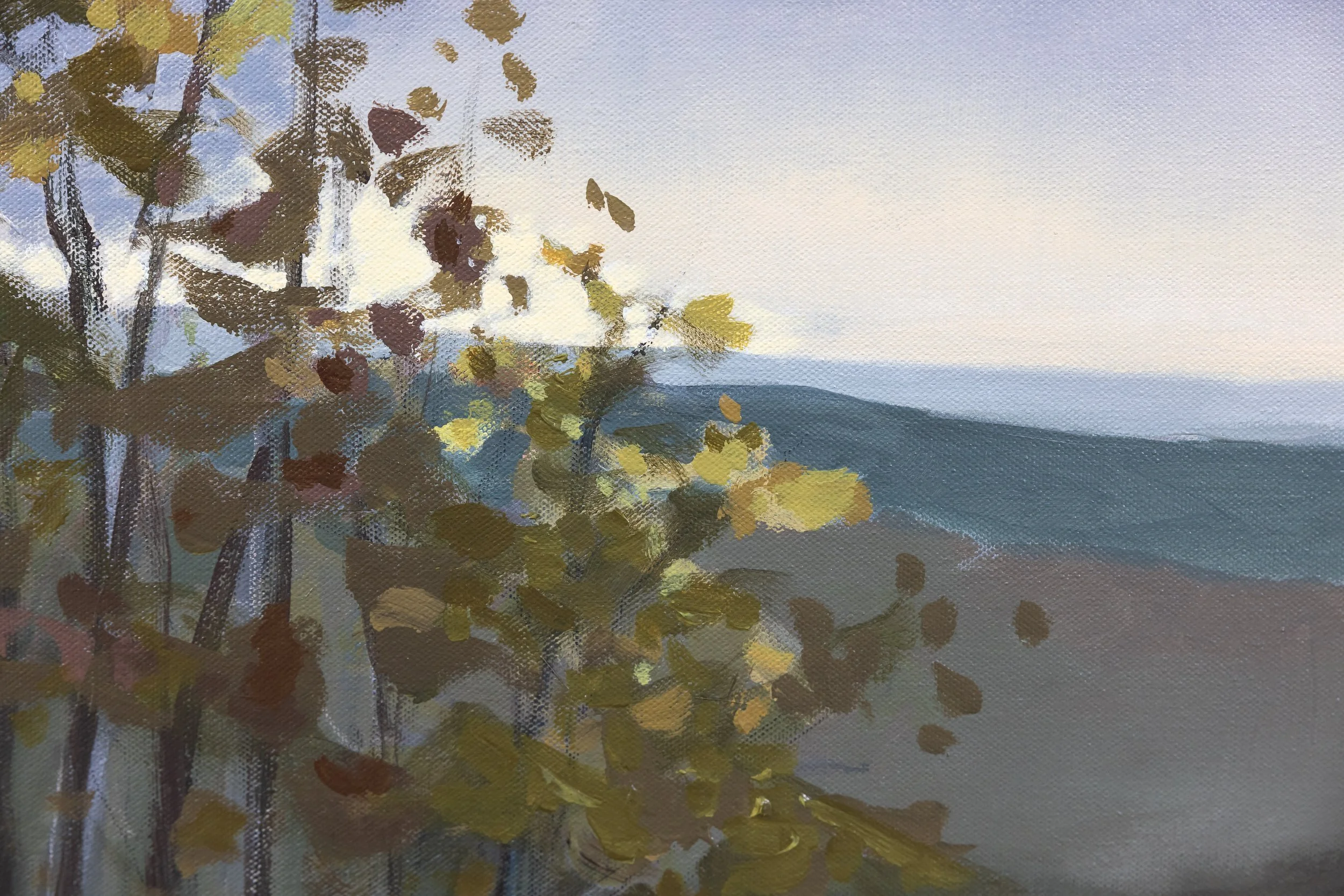 Detail of The First Glimpse of Light by Cheyenne Trunnell, showing golden-green leaves framing distant blue-gray hills beneath a softly lit sky.