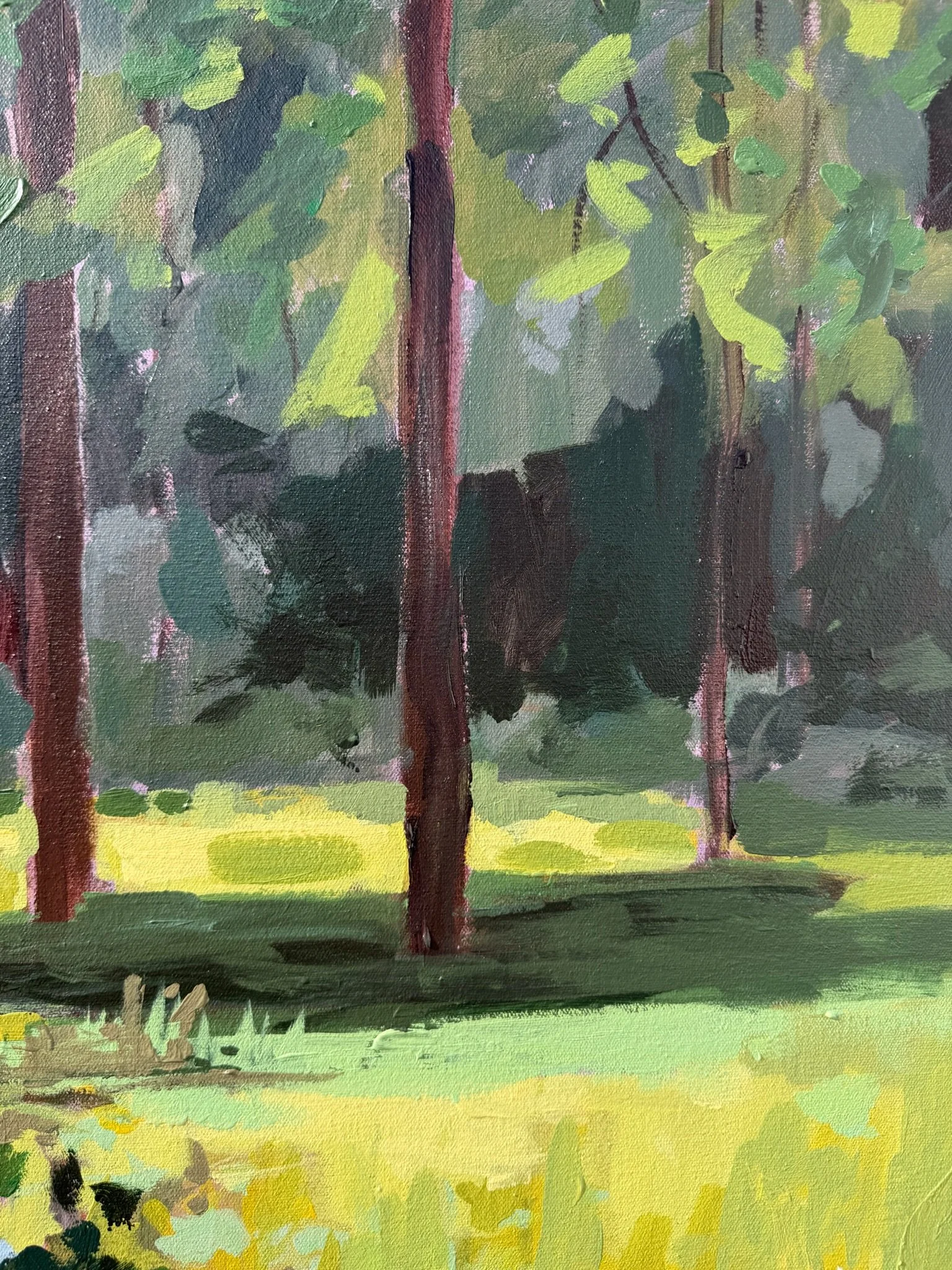Detail of tall trees casting light and shadow across a peaceful meadow landscape in Cheyenne Trunnell’s acrylic painting Beside the Still & Quiet Water.