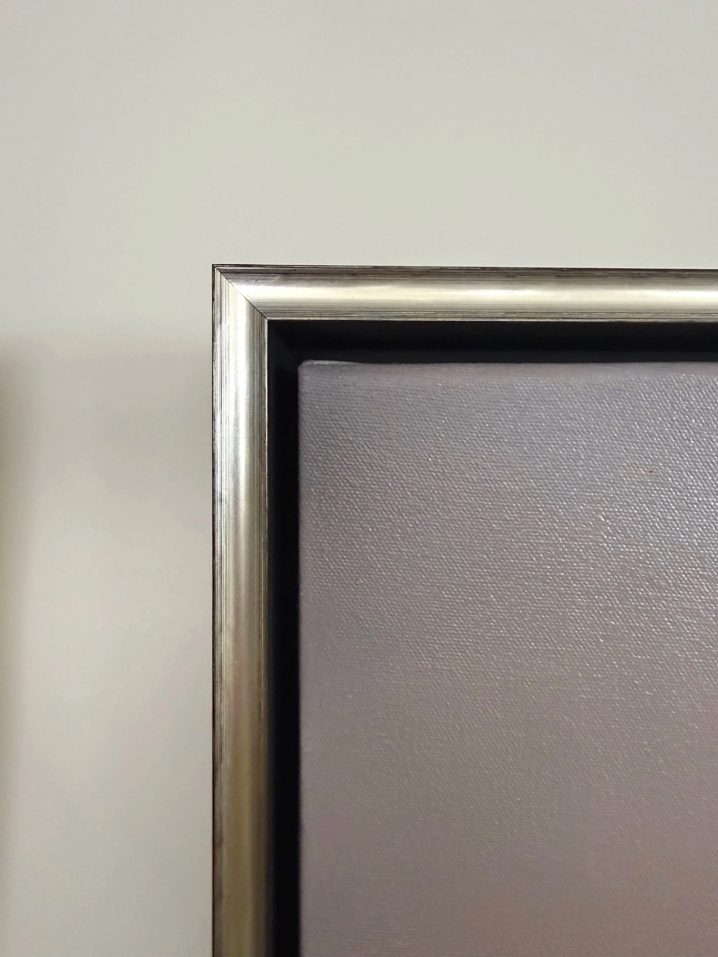 Close-up of silver frame for Cheyenne Trunnell’s 24x24 oil painting ‘Revealing Light II.