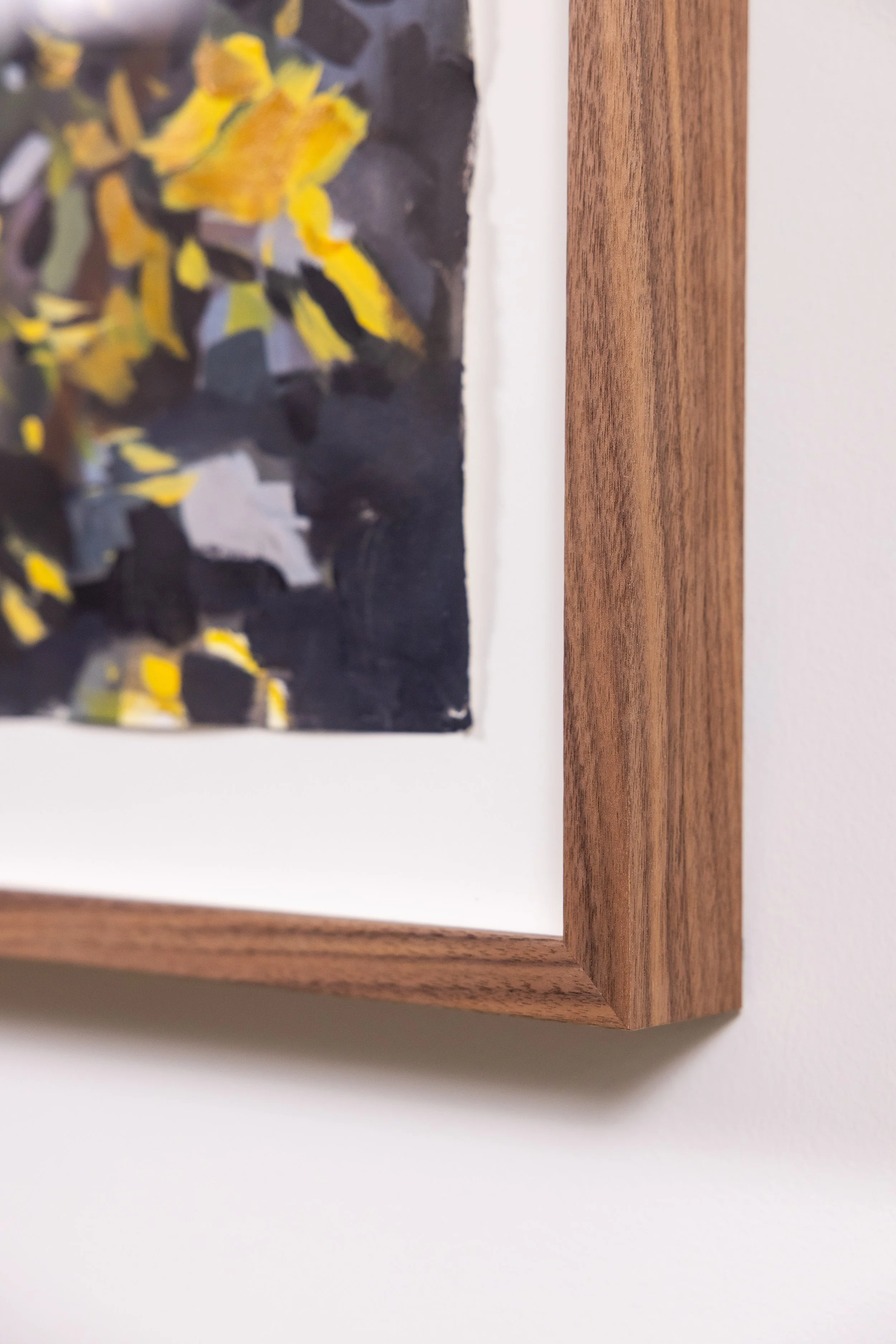 Detail of framed landscape painting by Asheville artist Cheyenne Trunnell showing brushwork and wood frame.