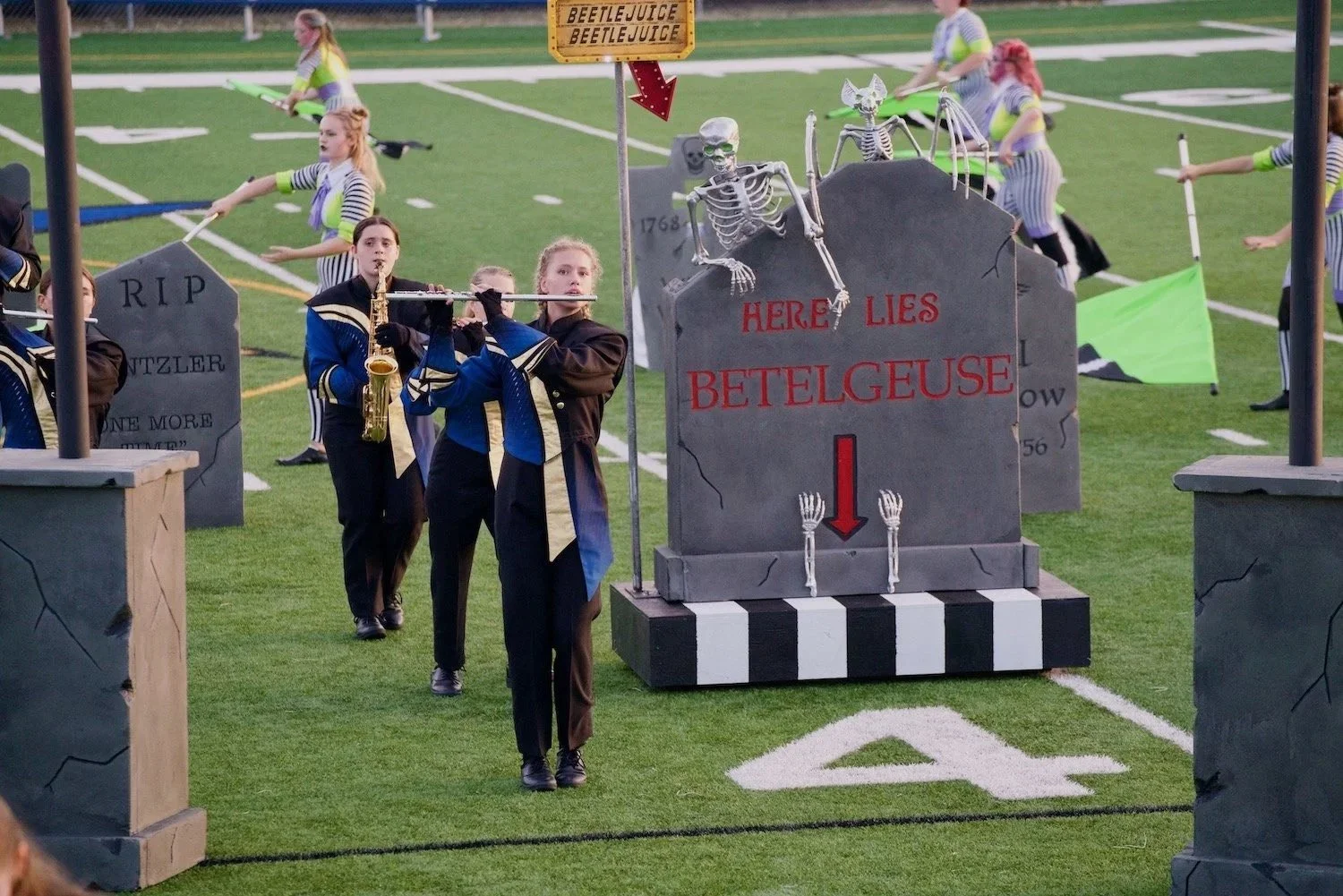 Hastings High School senior Elsie Jacobs performing with the school band during a Beetlejuice-themed performance at Todd Field in Hastings, Minnesota.