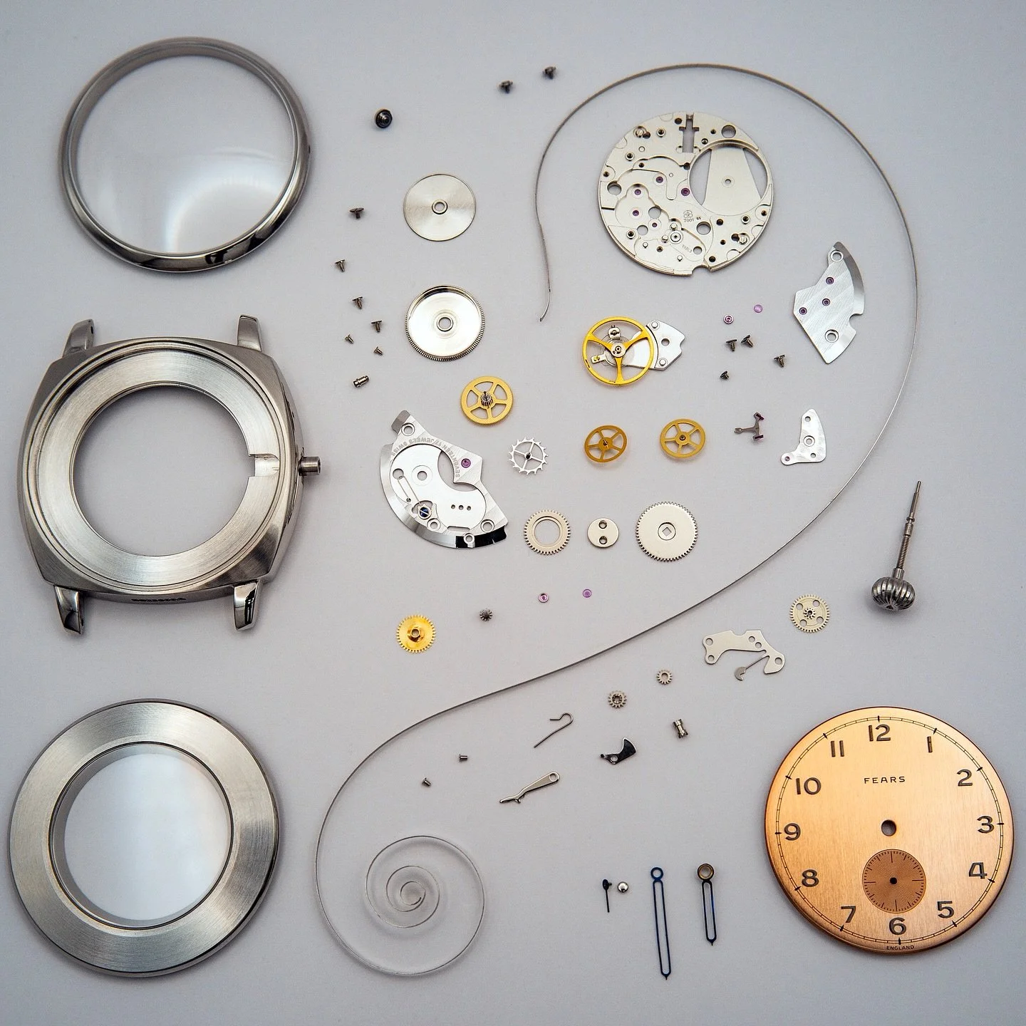 Fully exploded Fears Watch Brunswick in Salmon, year unknown but newish, with ETA caliber 7001.