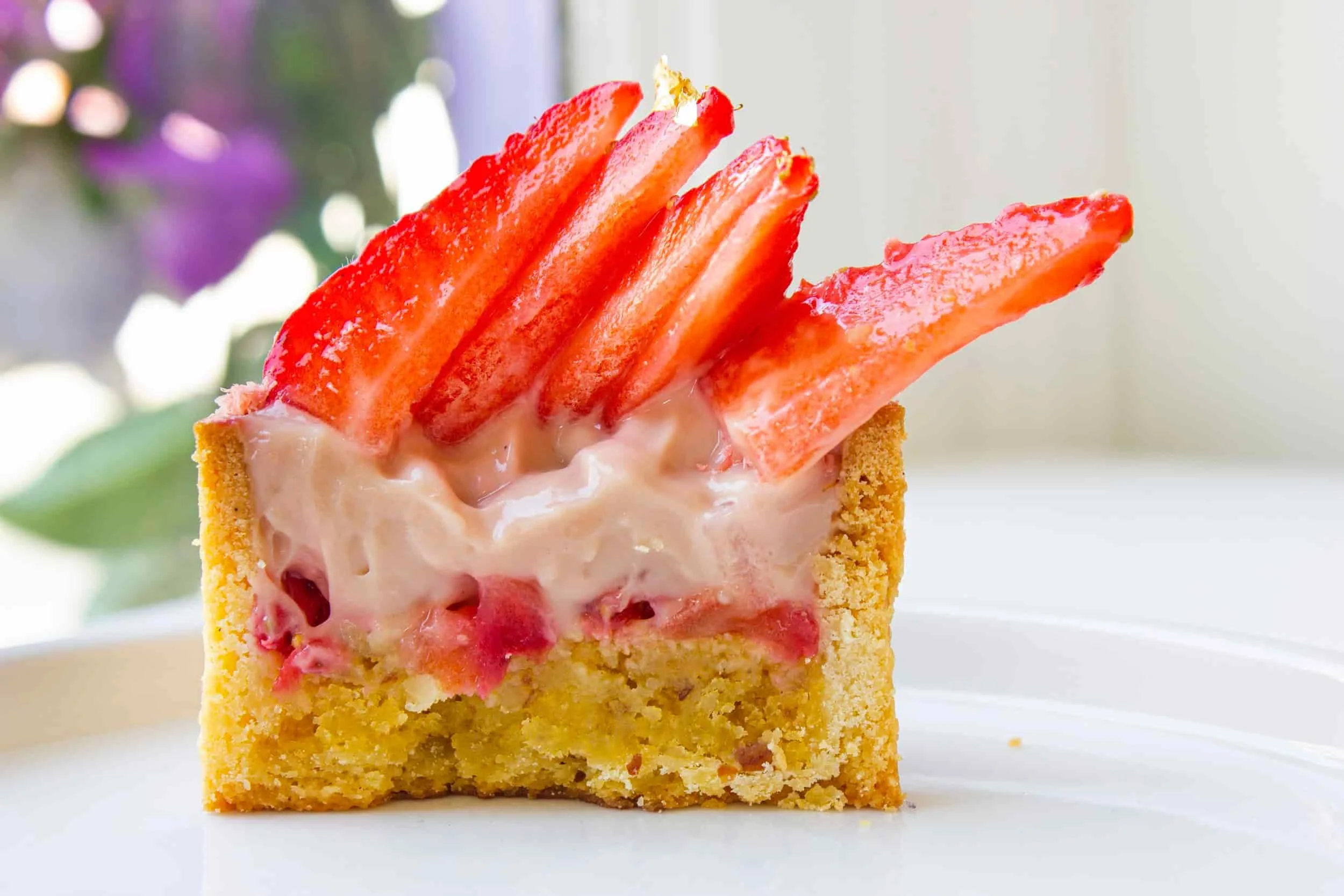 Strawberry Tart: Almond frangipane, pastry cream with hints of strawberry, fresh fruit, and vanilla shortcrust pastry