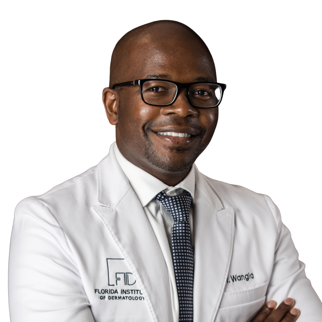 A smiling man wearing glasses, a white lab coat with 'Florida Institute of Dermatology' and 'Wangla' embroidered on it, a checkered tie, and posing with arms crossed.