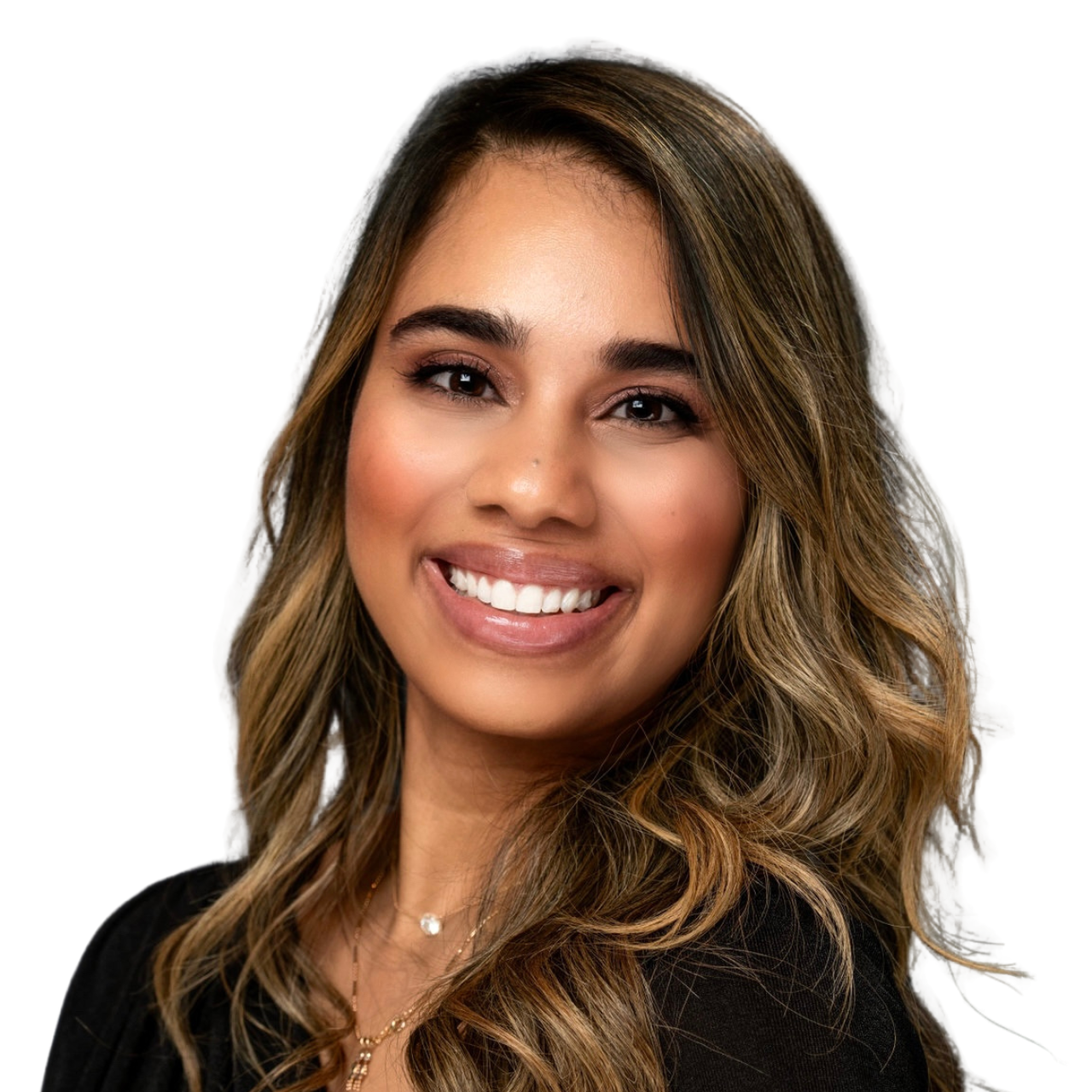 Portrait of a young woman with long, wavy brown hair, smiling and wearing a black top and layered necklaces against a dark, textured background.