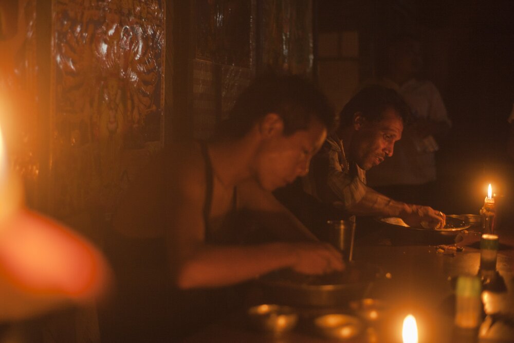 ‘Truck drivers enjoy a candle-lit dinner at Maa Kali Dhaba in Nagaland’. Photo: Ozzie Hoppe