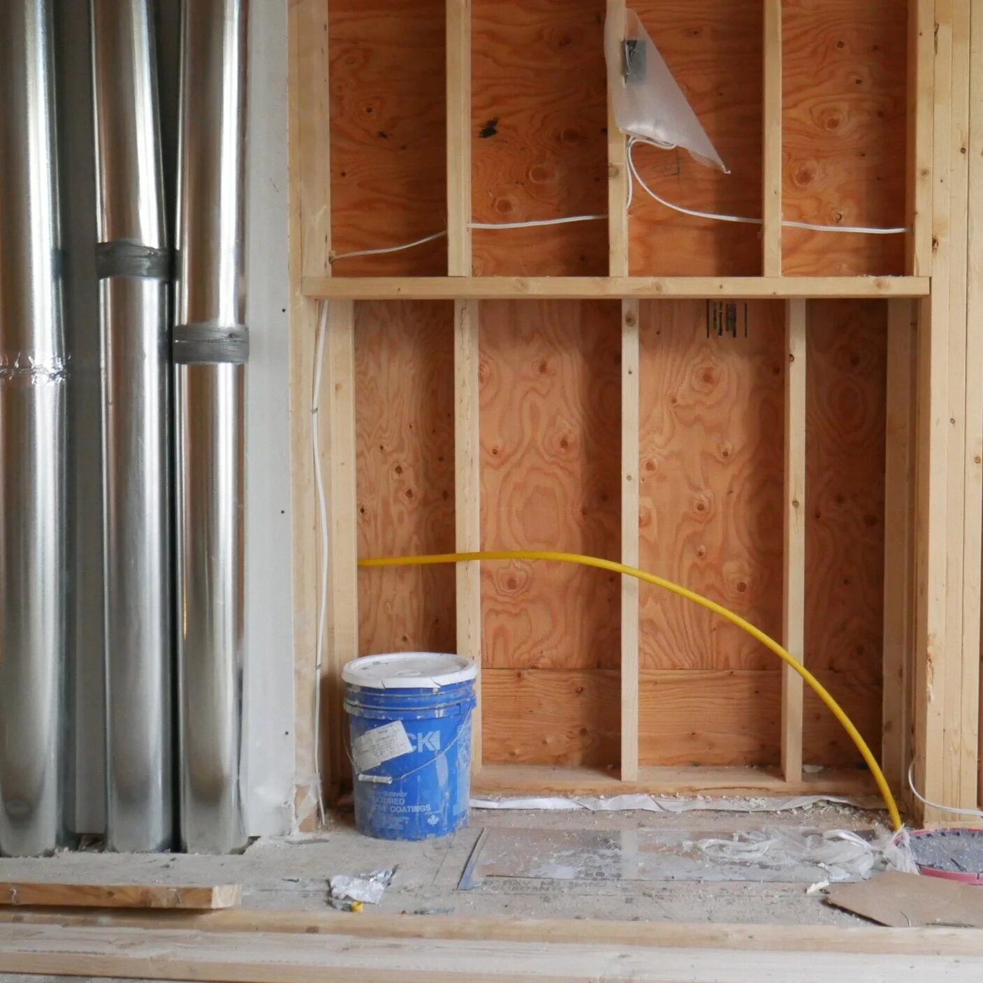   Example of HVAC and plumbing rough-ins awaiting to be framed and drywalled to create wall bulkheads.  