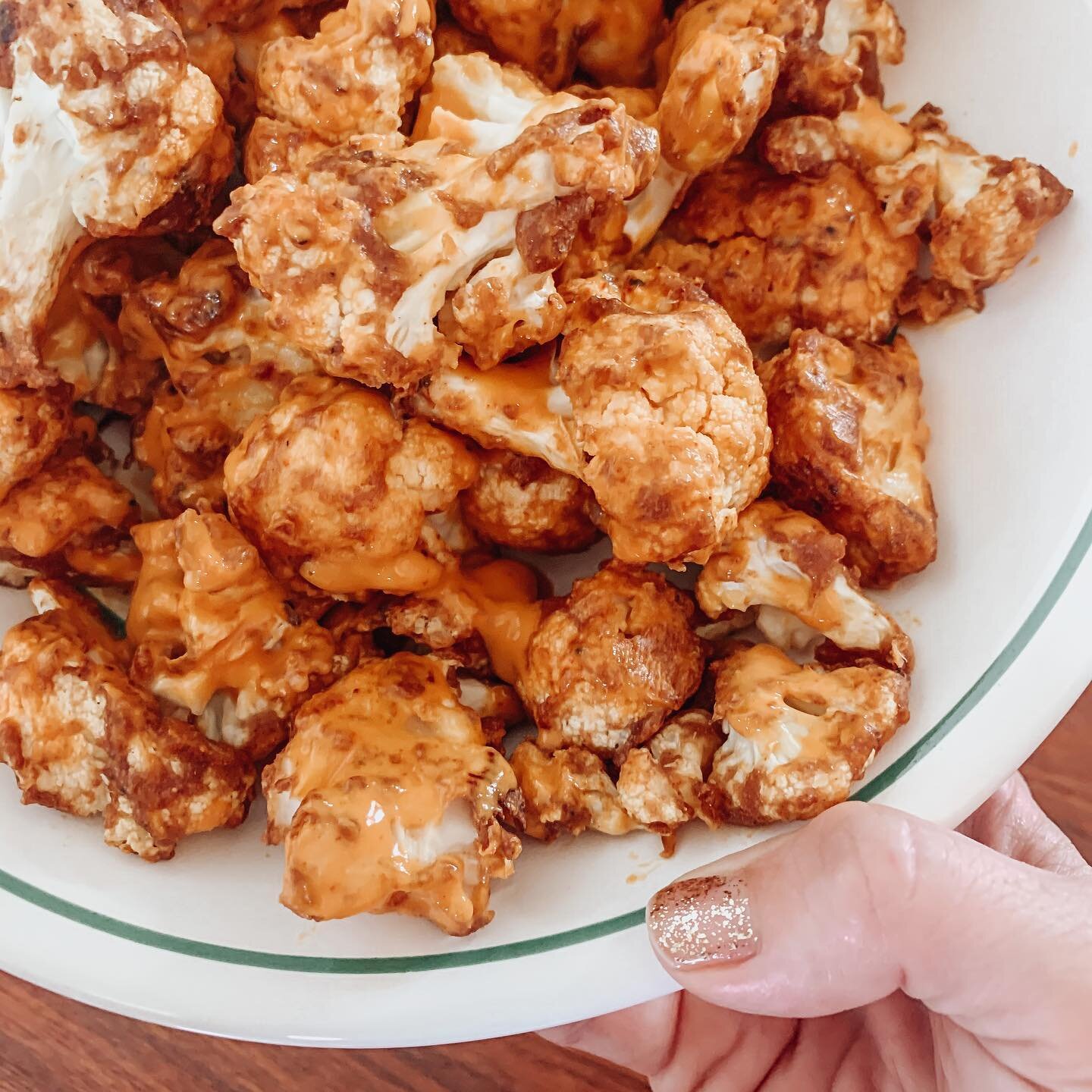 Homemade Buffalo cauliflower. 🤤 guess the cravings don&rsquo;t go away postpartum!

Preheat oven to 425. Separate one head of cauliflower into florets. 

Mix:
1/3 cup whole wheat flour
1/3 cup water
1 tsp smoked paprika
1/4 tsp salt

Toss cauliflowe