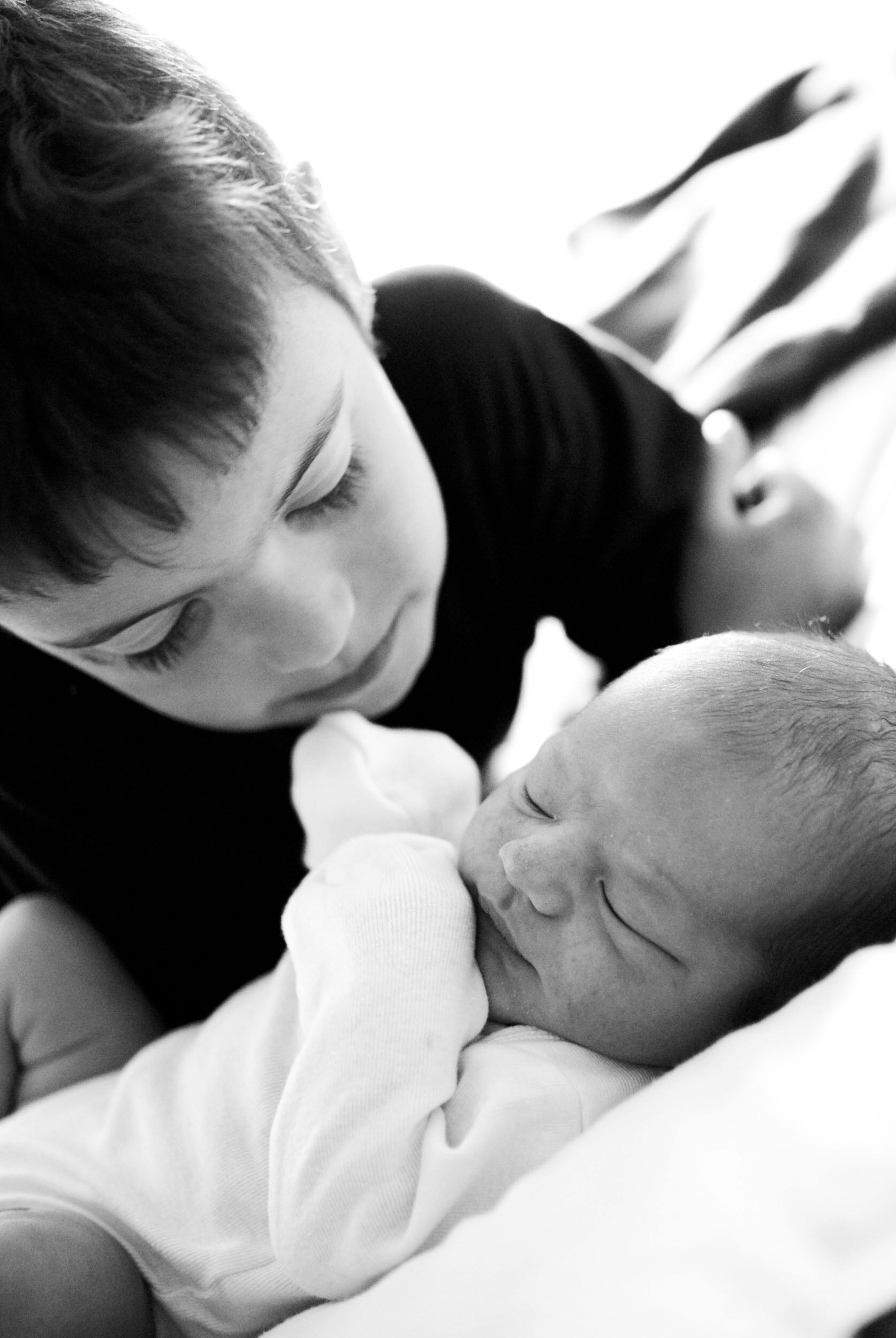 Sibling and newborn baby at Maine homebirth