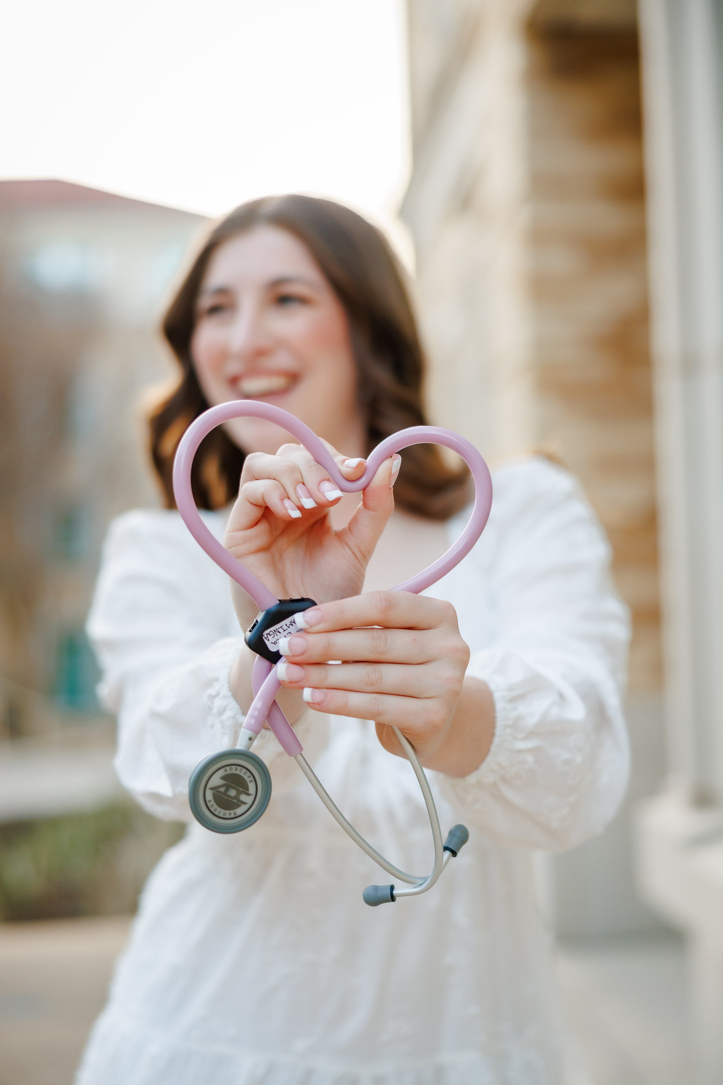 Ideas-for-Grad-Photos-at-Texas-Christian-University-senior-nurse-graduate