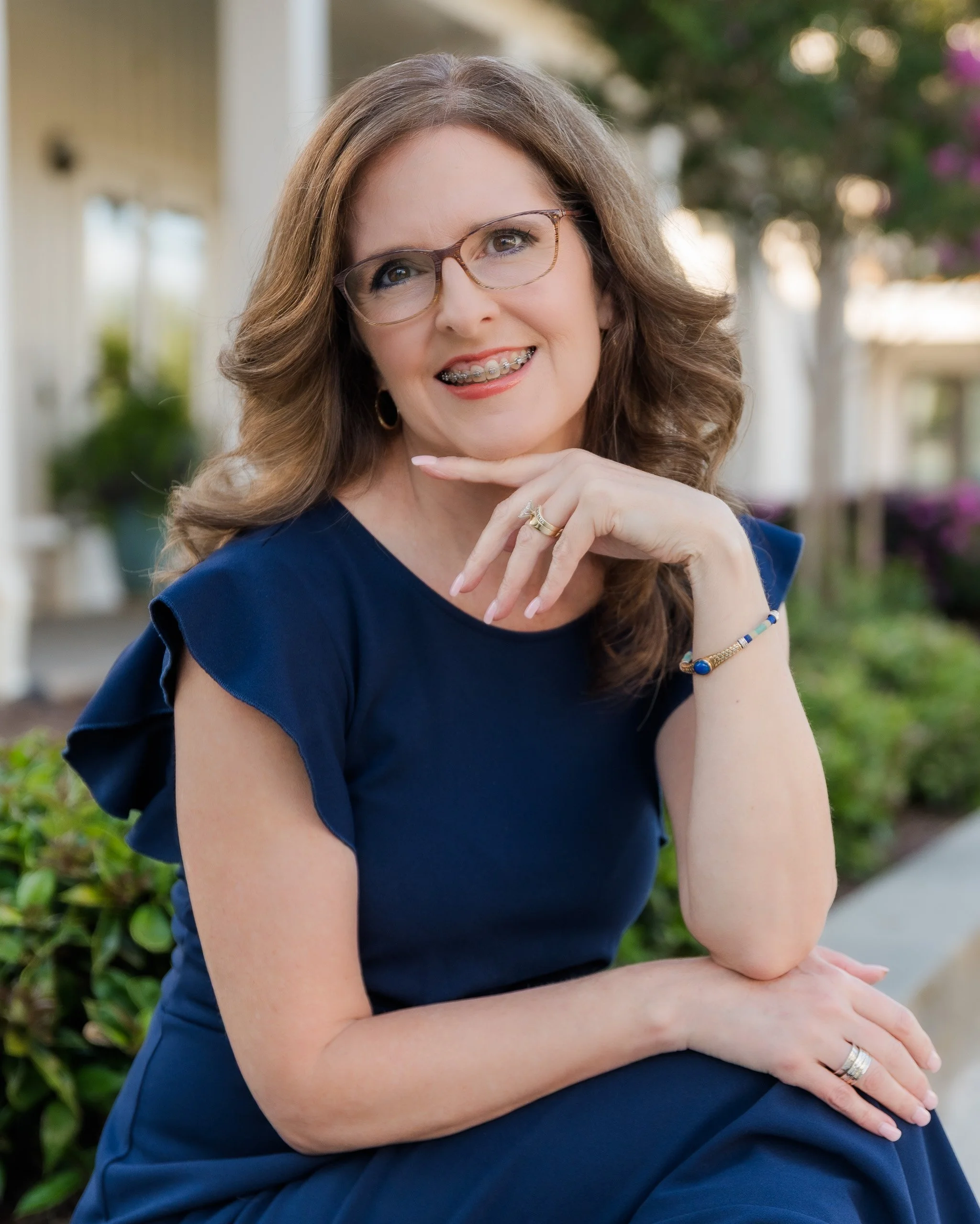 Professional branding headshot of DeAndra Jarboe, Fort Worth photographer, showcasing her approachable and creative style.