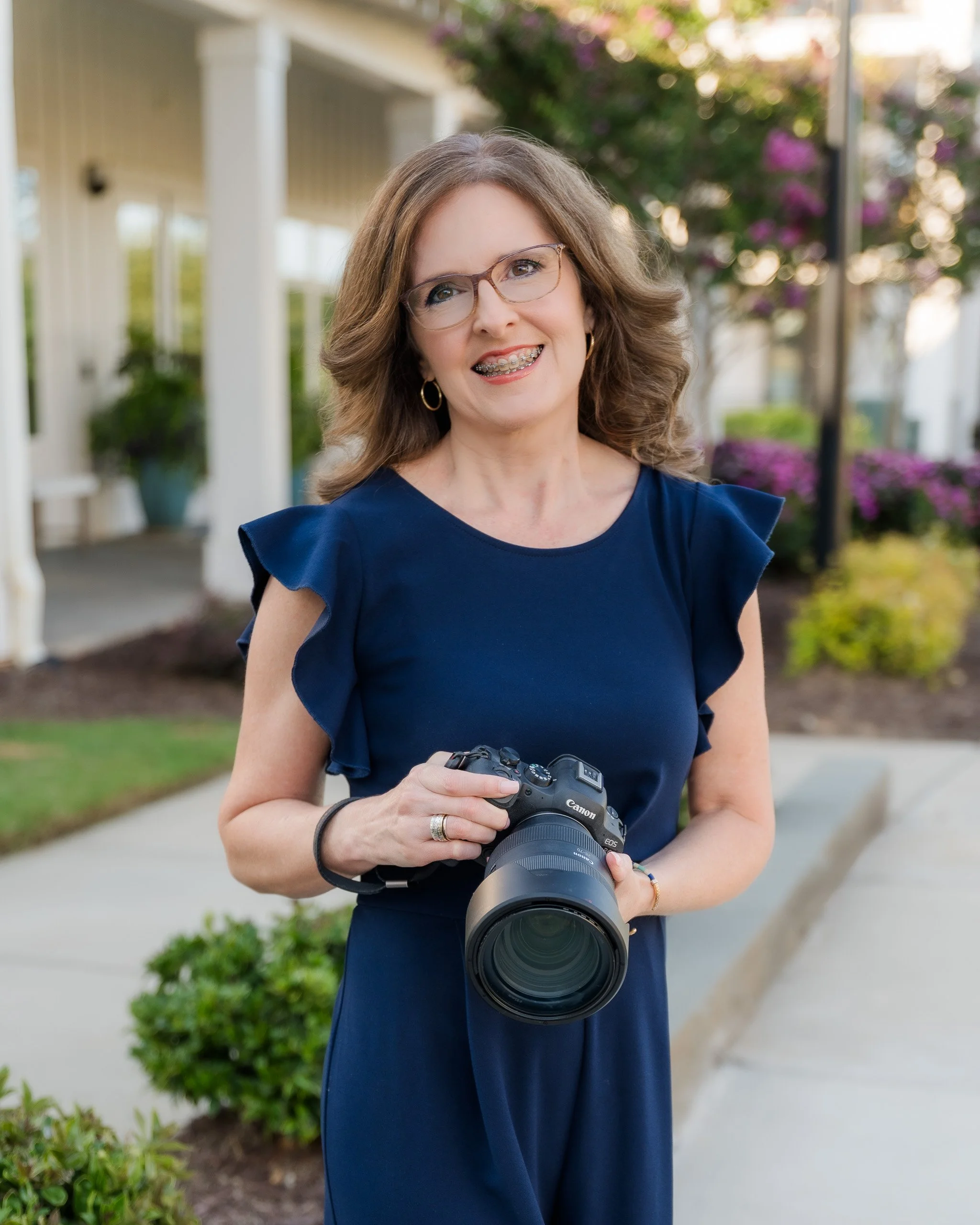Professional portrait of Fort Worth photographer DeAndra Jarboe smiling outdoors