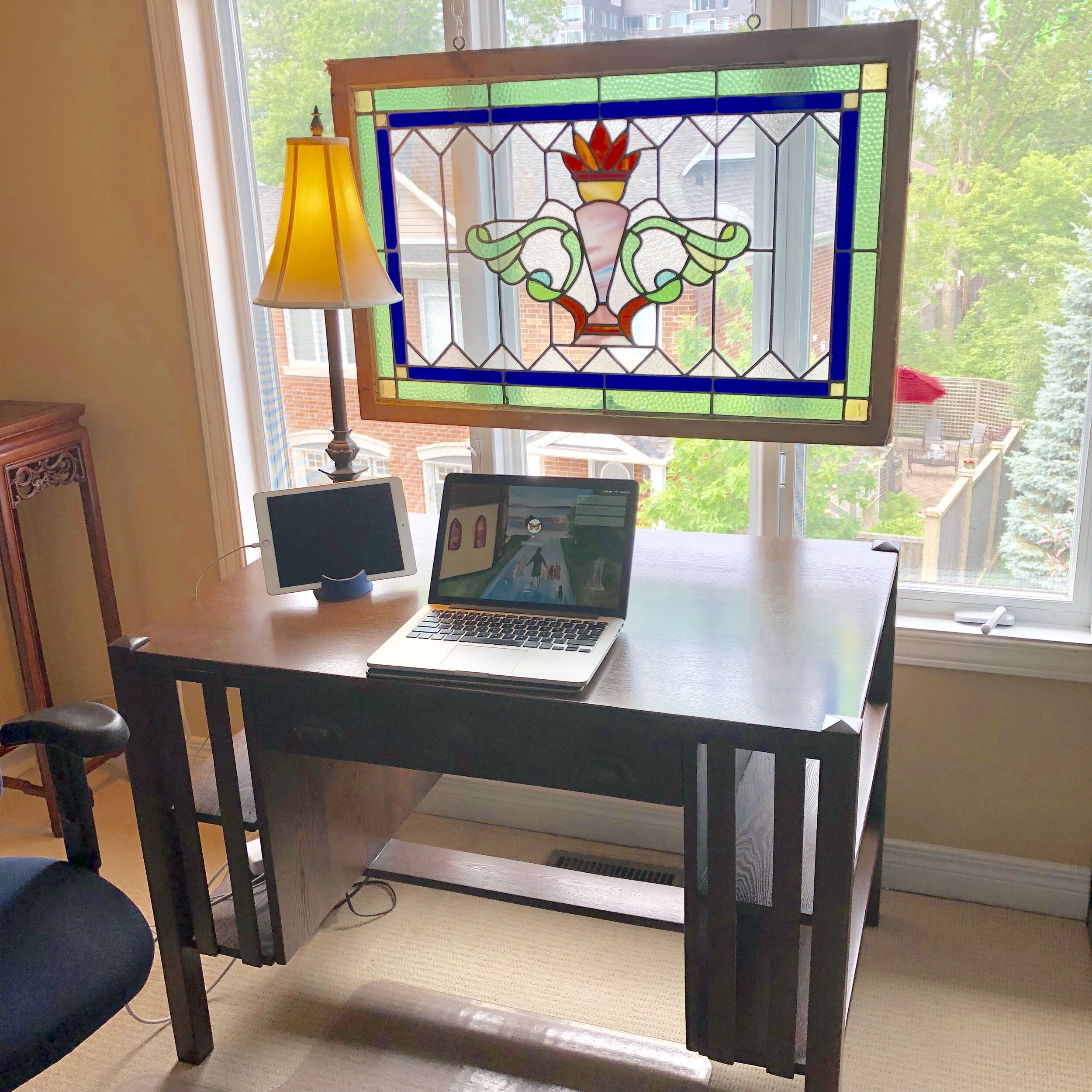  This is my writing space in Ottawa. The photo of Roger Flynn’s painting of Mary as Pied Piper is on my screen.  The beautifully refurbished antique desk is a joy to behold - and useful too! 