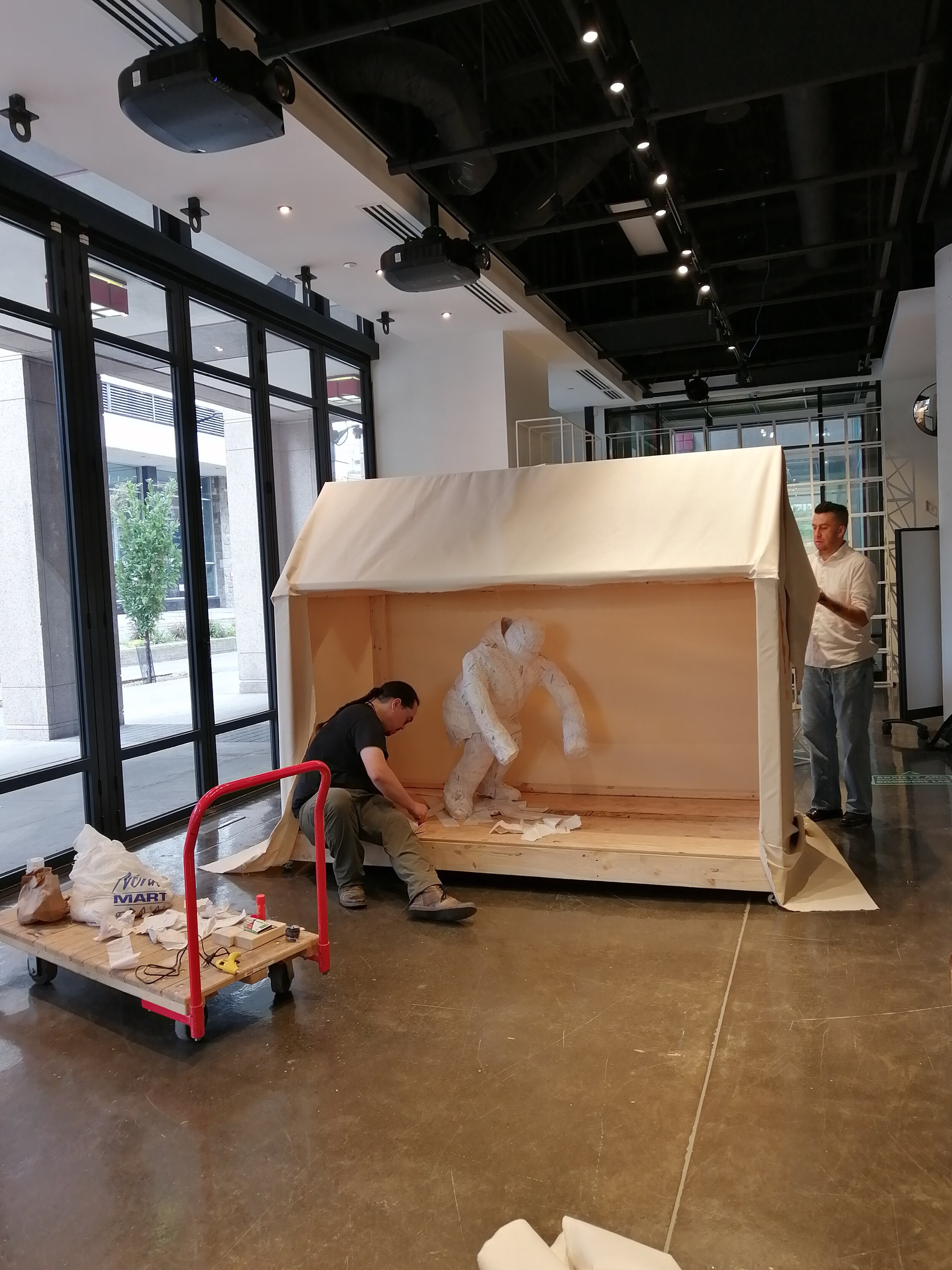  Jason Sikoak and Jesse Tungilik installing  Labrador Tent &nbsp;(2019) and&nbsp; Feeding My Family  (2019) for  Memory Keepers I  at Concorida’s 4th Space, Montreal QC. October 2019. Photo by Danielle Aimée Miles. 