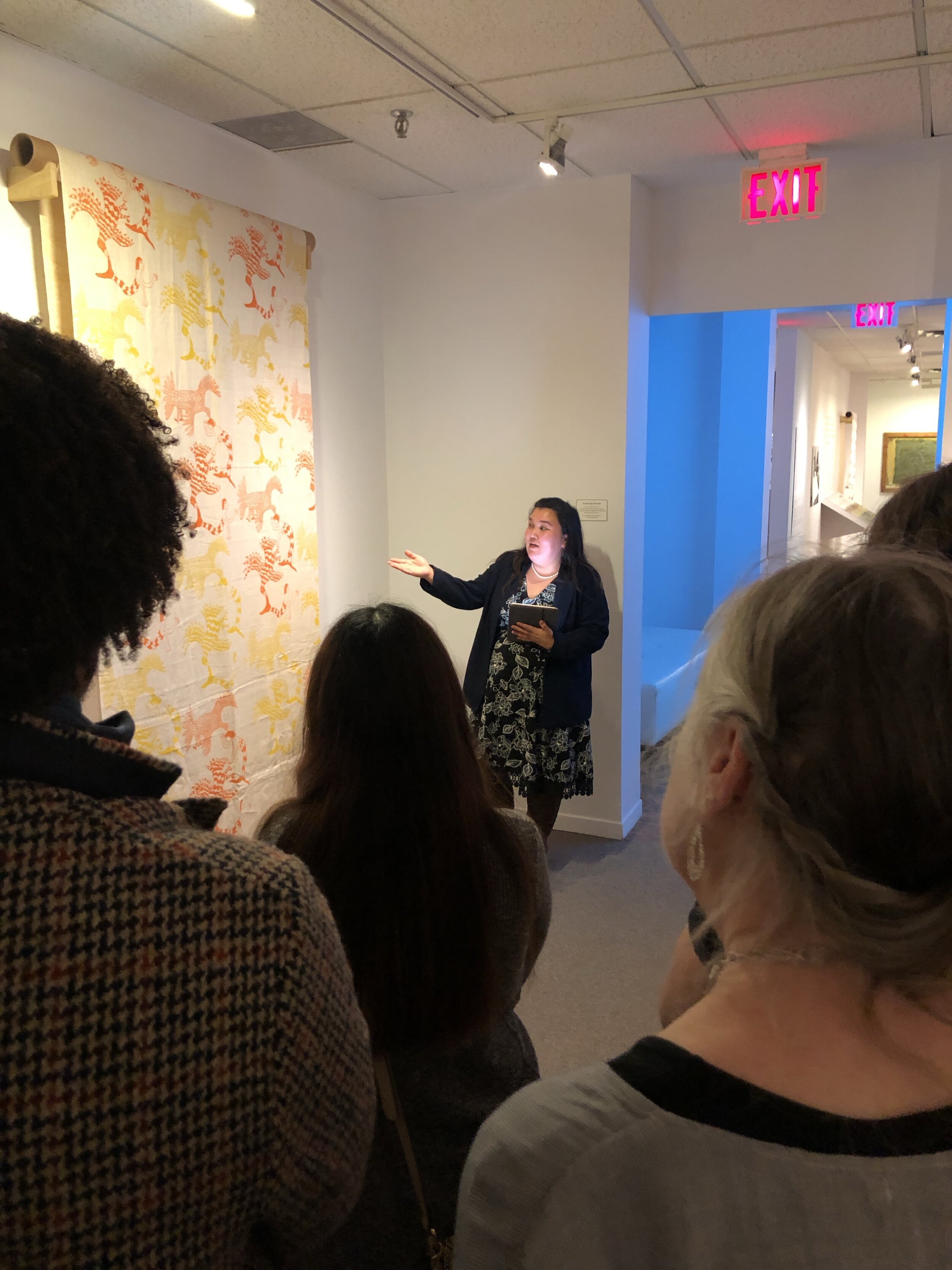  Nakasuk giving a tour of the Textile Museum of Canada, Toronto ON, focusing on artists from her community and Kinngait Studios. December 2019. Photo courtesy of Nakasuk Alariaq. 