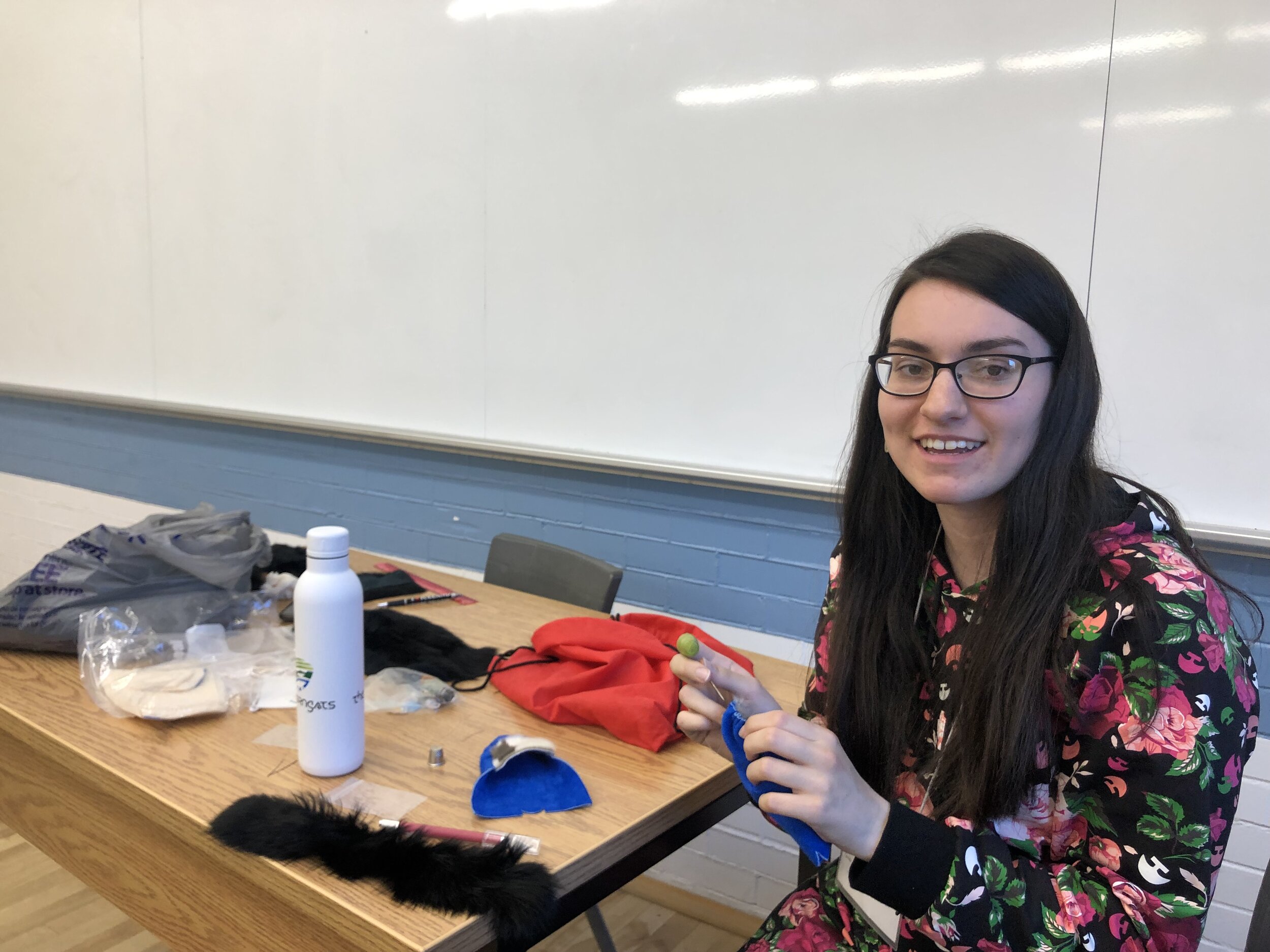  Veronica Flowers demonstrates sewing techniques during the Labrador Inuit Slipper Making Workshop. Veronica and Vanessa Flowers led the workshop at the 21st Inuit Studies Conference, UQAM, Montreal QC. October 2019. Photo courtesy of Heather Iglolio